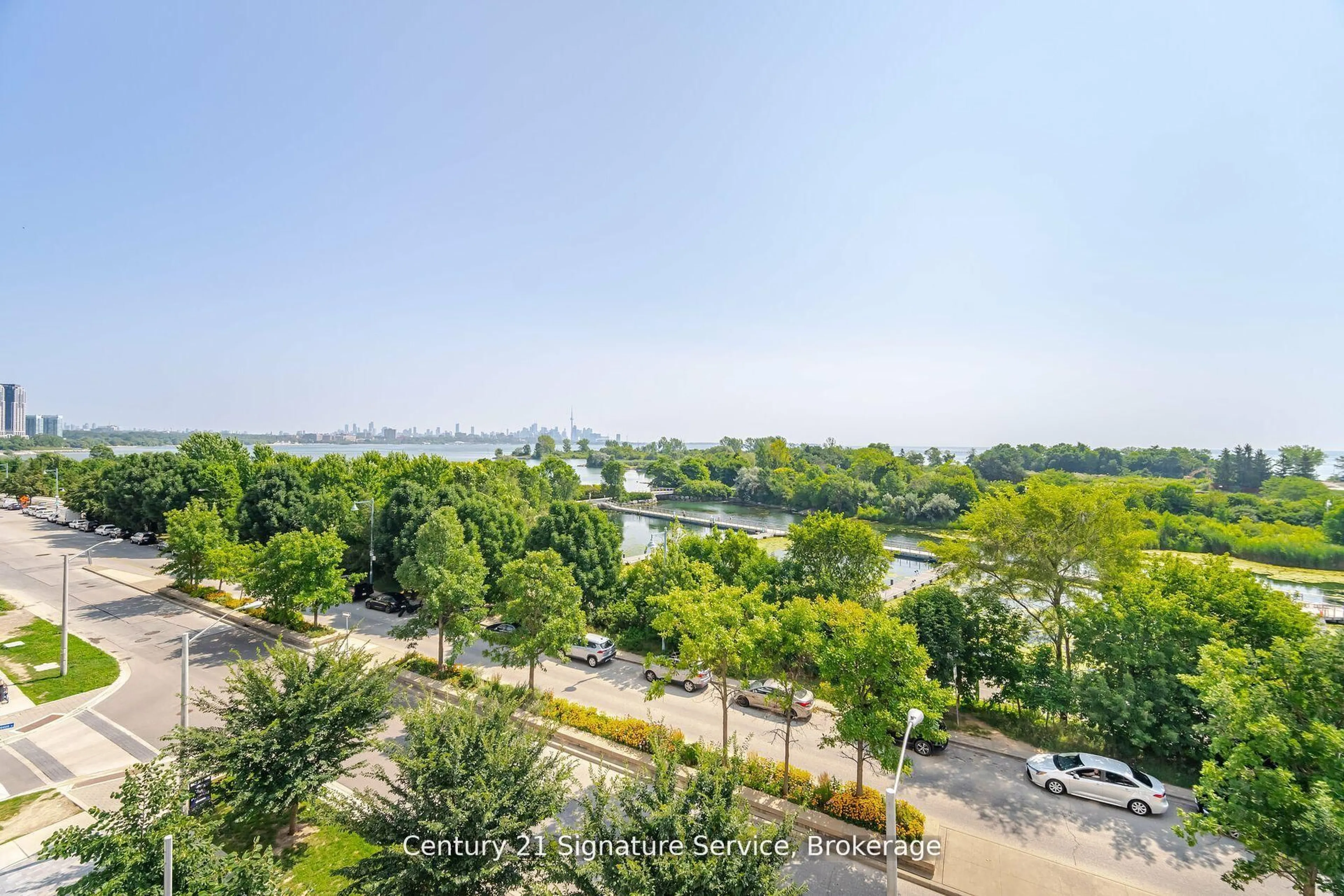 A pic from outside/outdoor area/front of a property/back of a property/a pic from drone, city buildings view from balcony for 20 Shore Breeze Dr #312, Toronto Ontario M8V 0C7