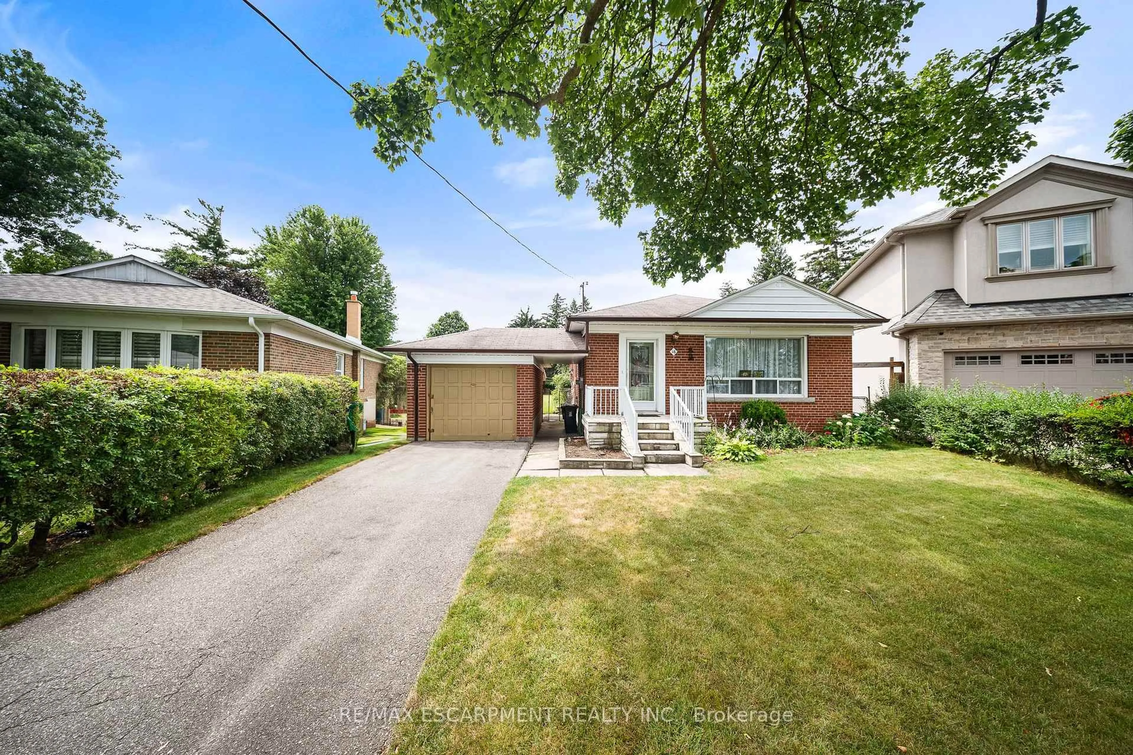 Home with brick exterior material, street for 16 Northampton Dr, Toronto Ontario M9B 4S6