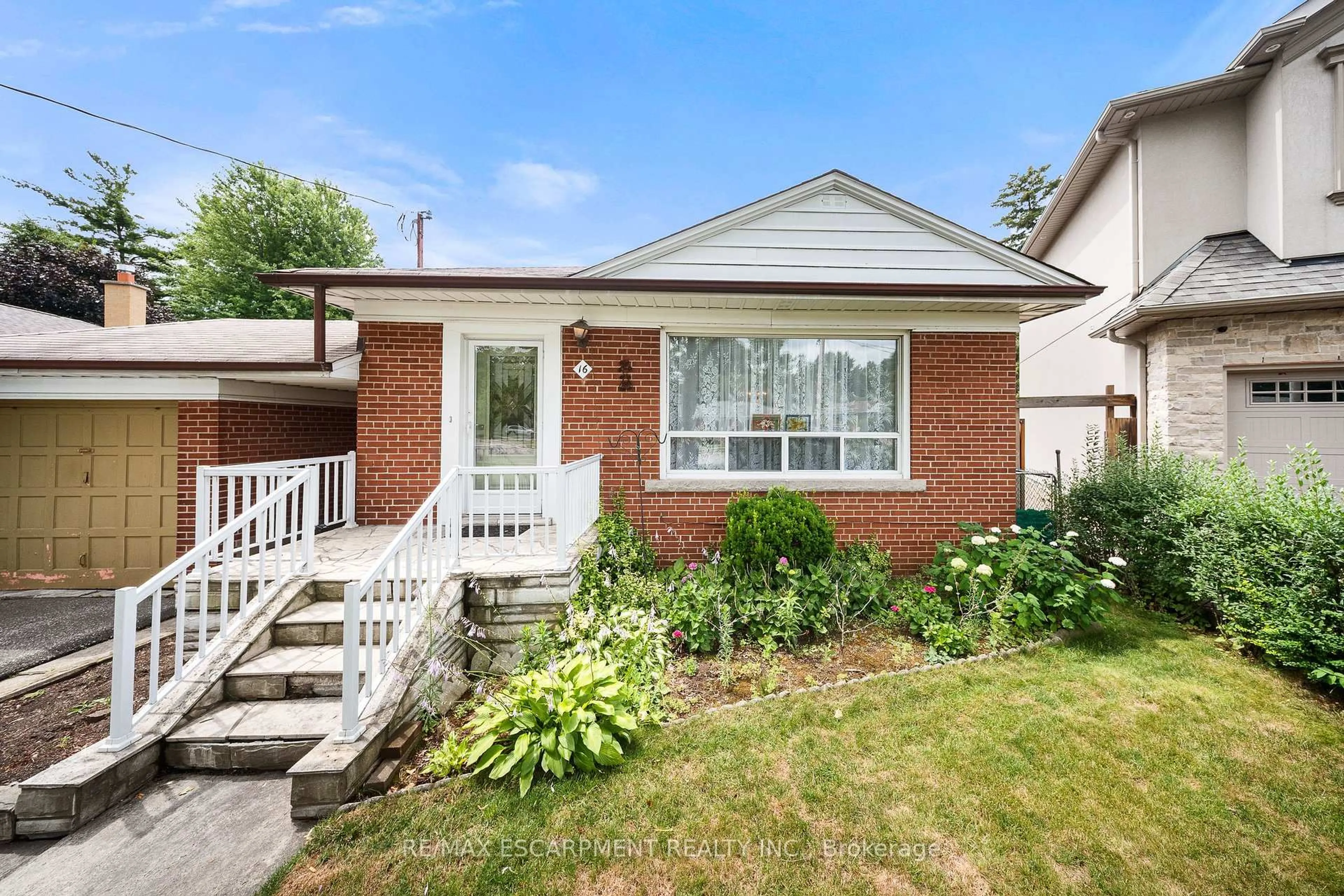 Home with brick exterior material, street for 16 Northampton Dr, Toronto Ontario M9B 4S6