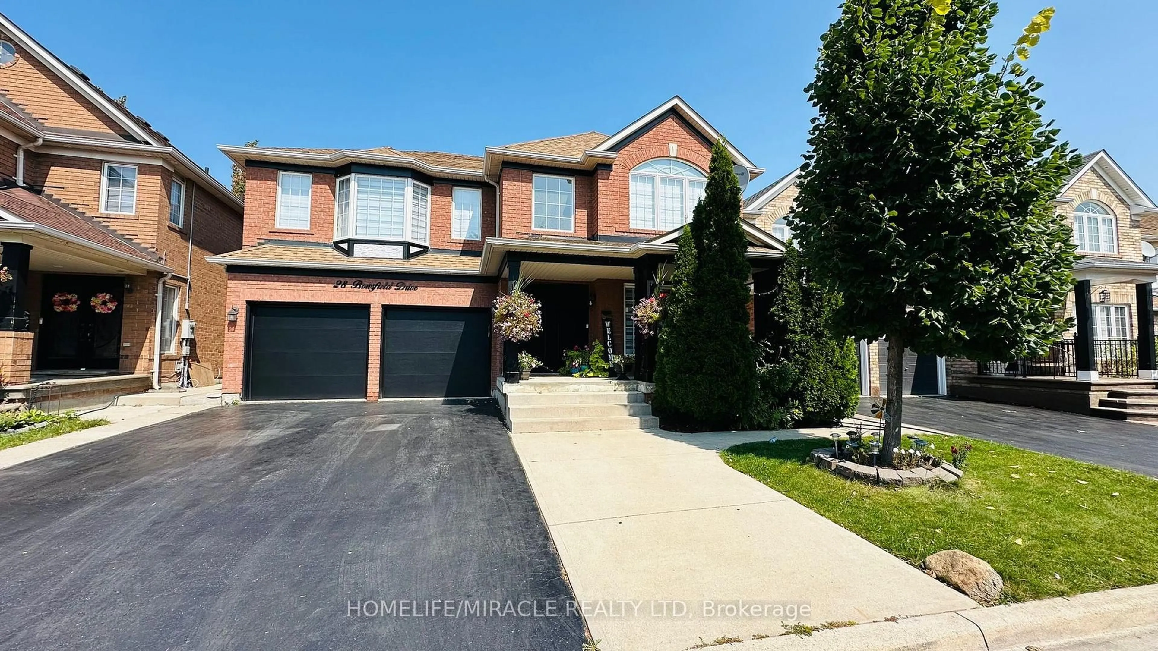 Home with brick exterior material, street for 28 Bowsfield Dr, Brampton Ontario L6P 1A6