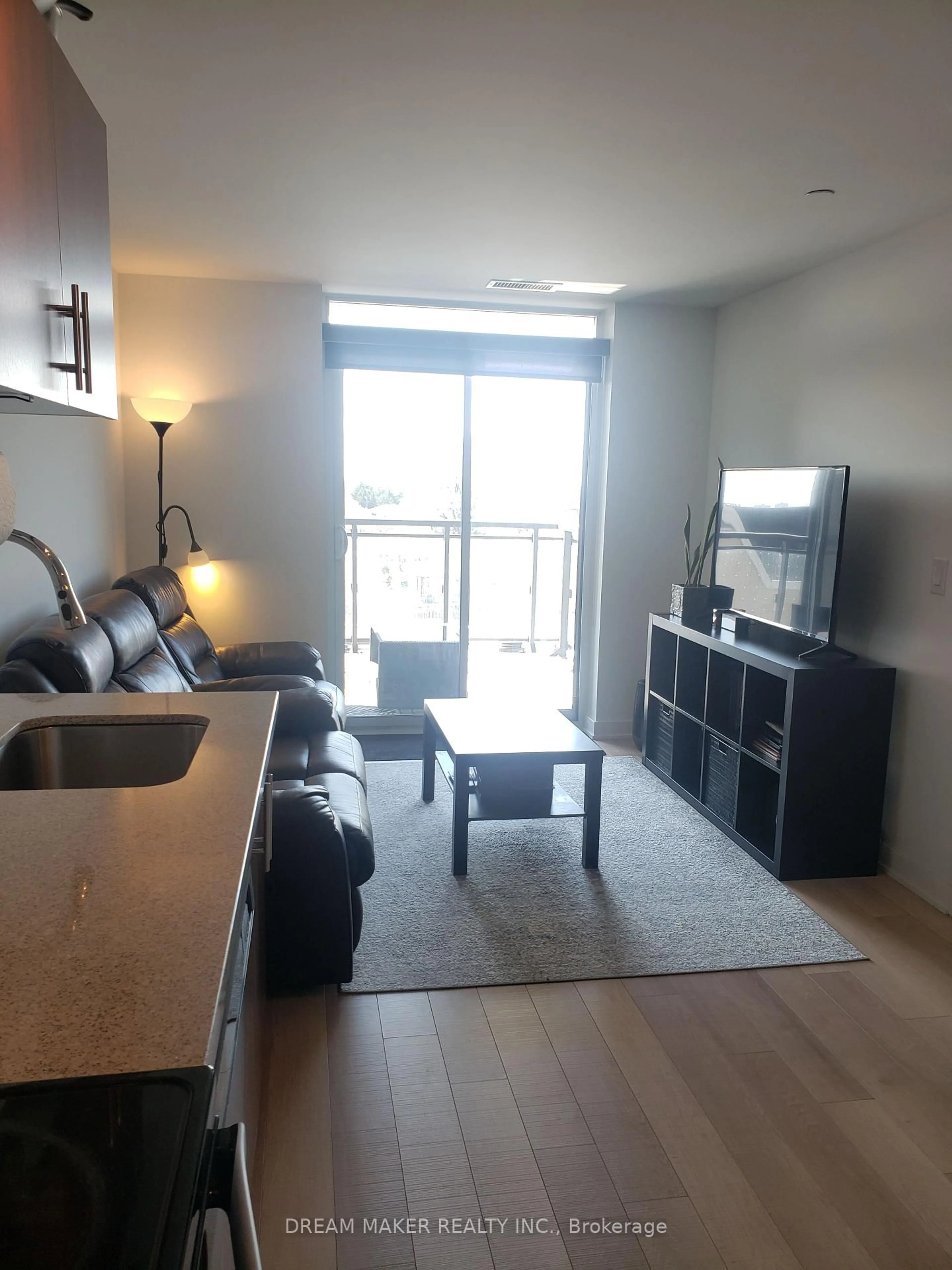 Living room with furniture, wood/laminate floor for 16 McAdam Ave, Toronto Ontario M6A 1S5