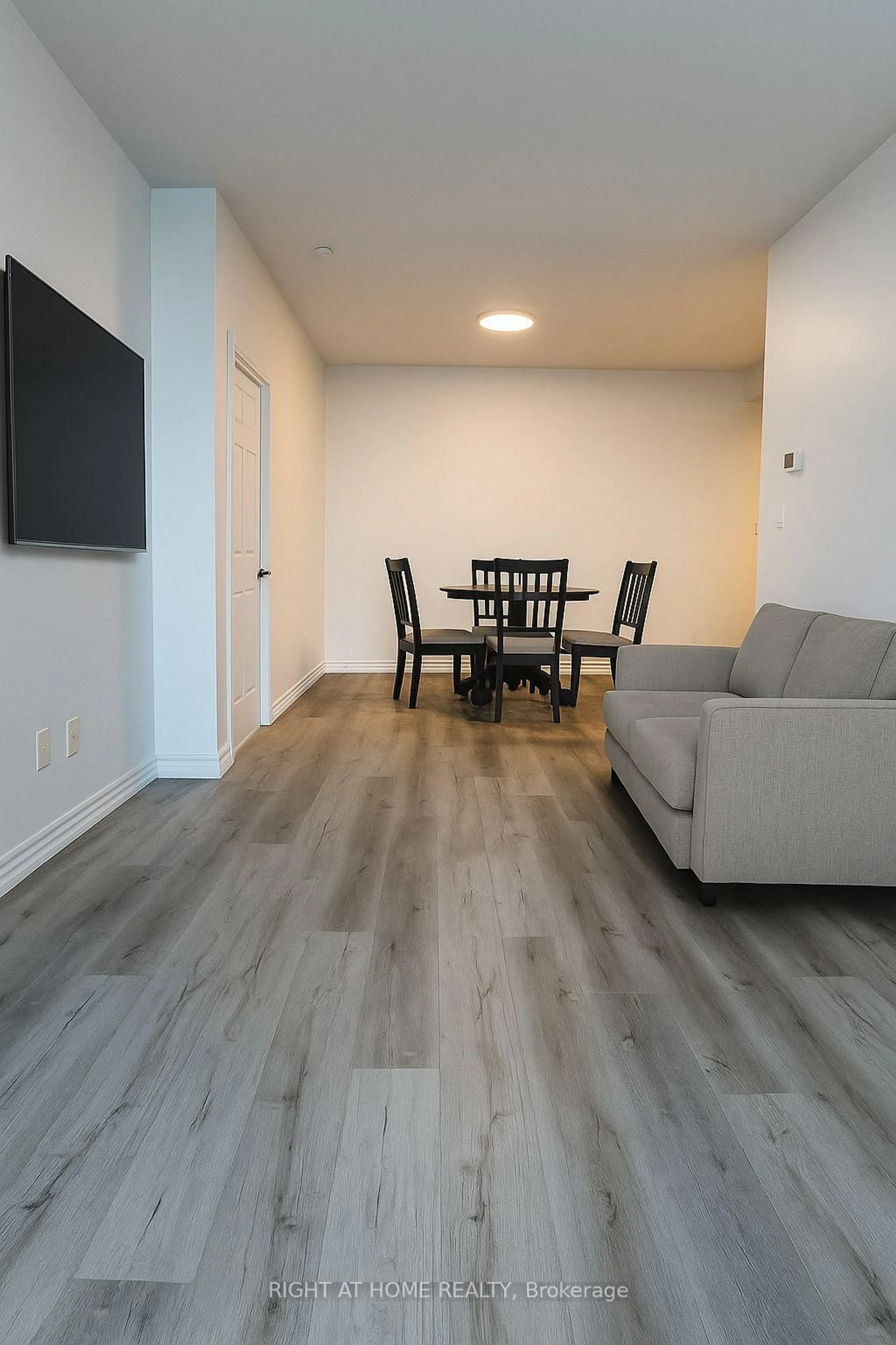 Living room with furniture, wood/laminate floor for 3504 Hurontario St #3503, Mississauga Ontario L5B 0B9