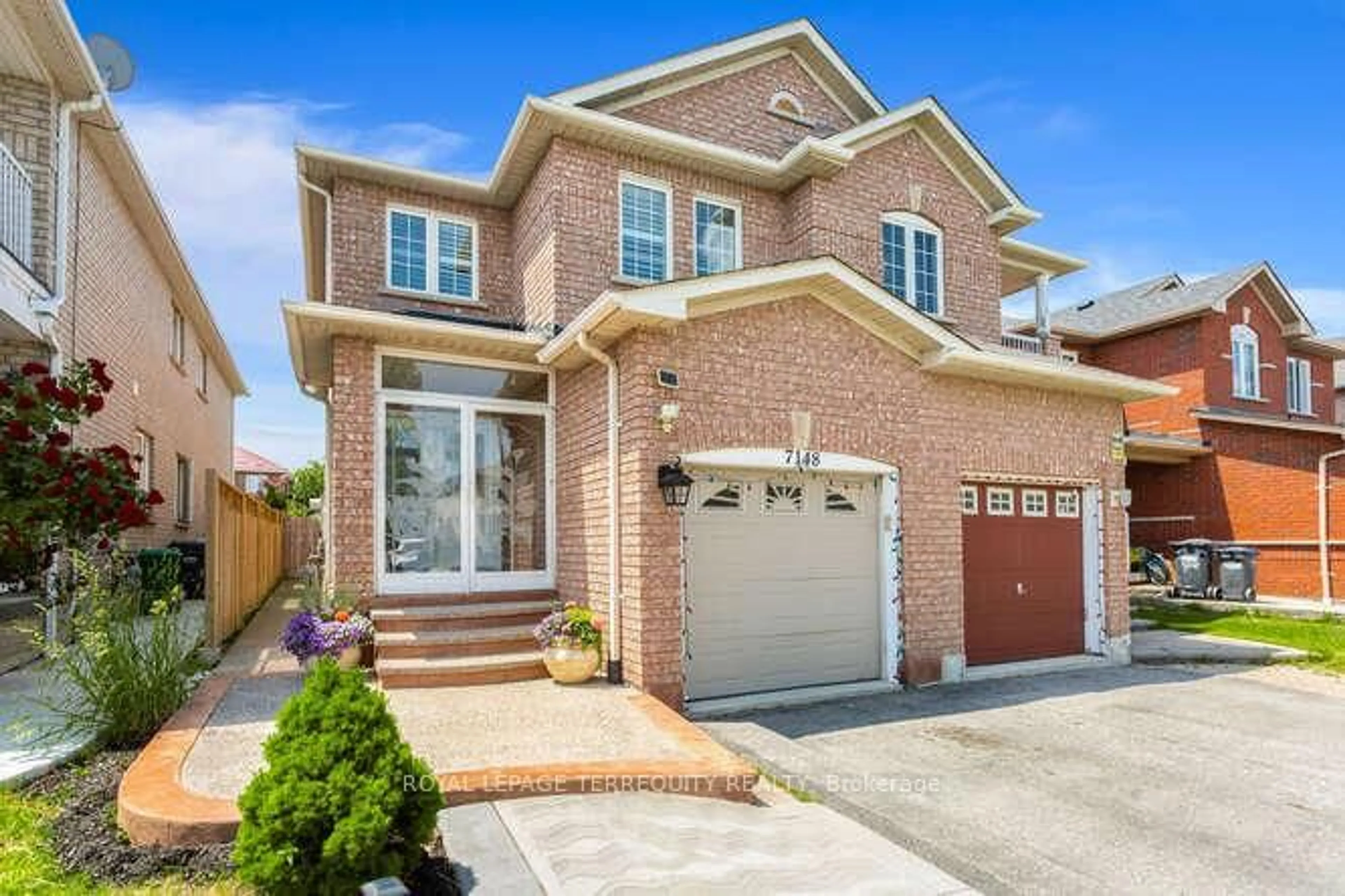 Home with brick exterior material, street for 7148 Village Walk, Mississauga Ontario L5W 1X2