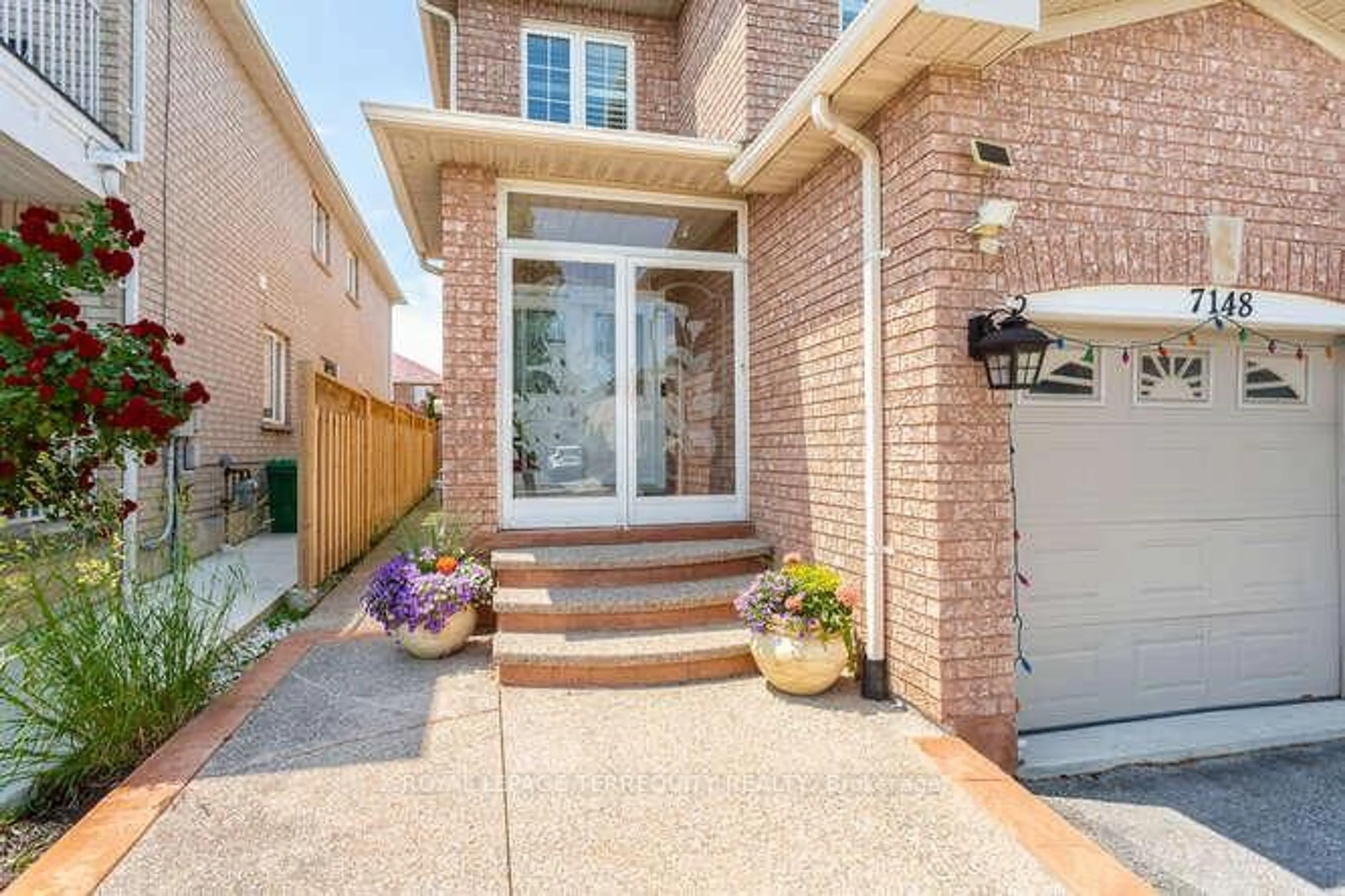 Home with brick exterior material, street for 7148 Village Walk, Mississauga Ontario L5W 1X2