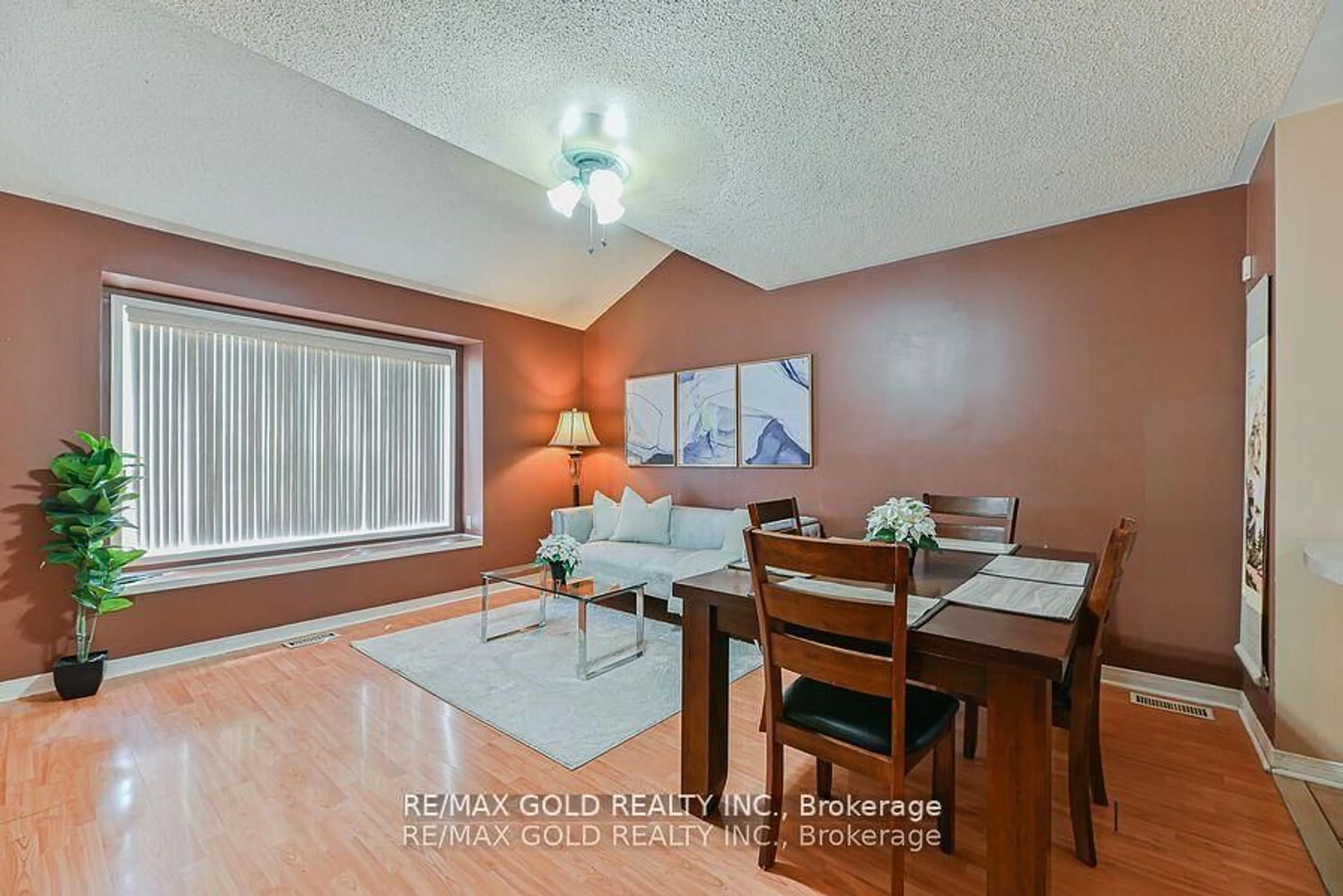 Living room with furniture, wood/laminate floor for 43 Giraffe Ave, Brampton Ontario L6R 1Y9