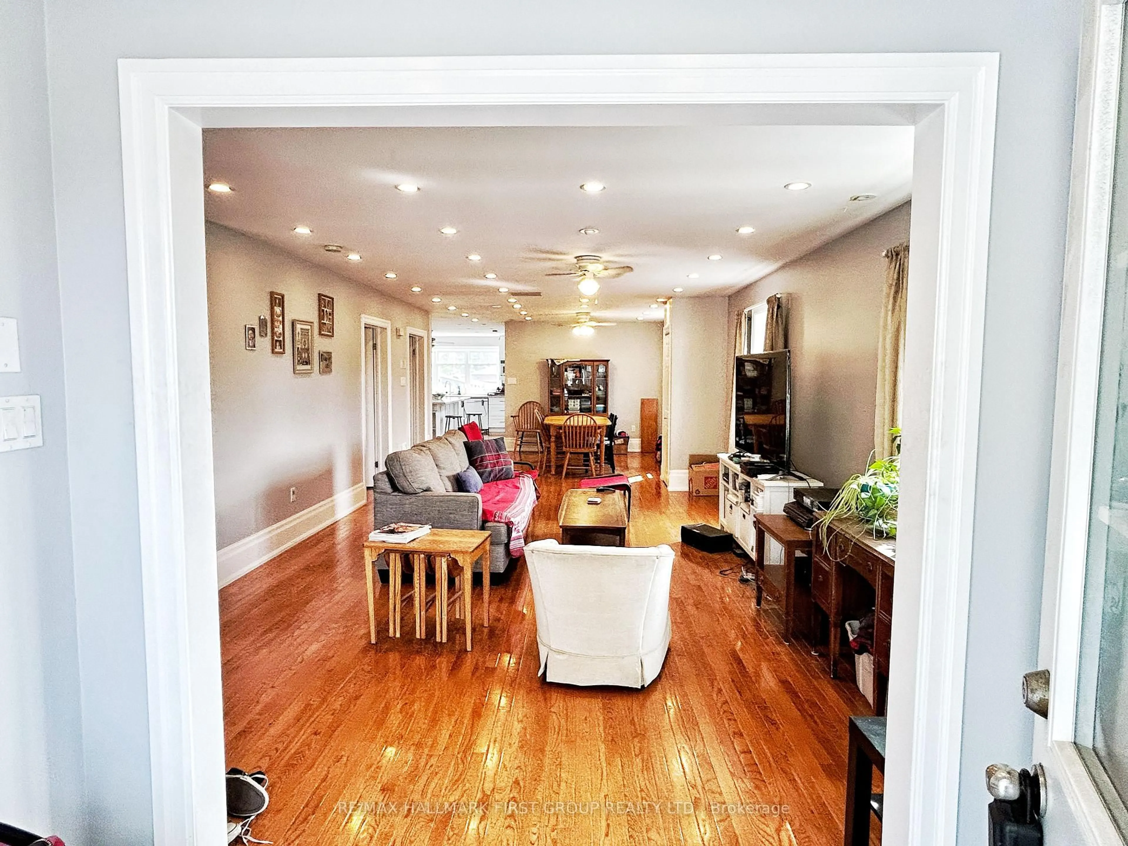 Living room with furniture, wood/laminate floor for 57 Wendell Ave, Toronto Ontario M9N 3K8