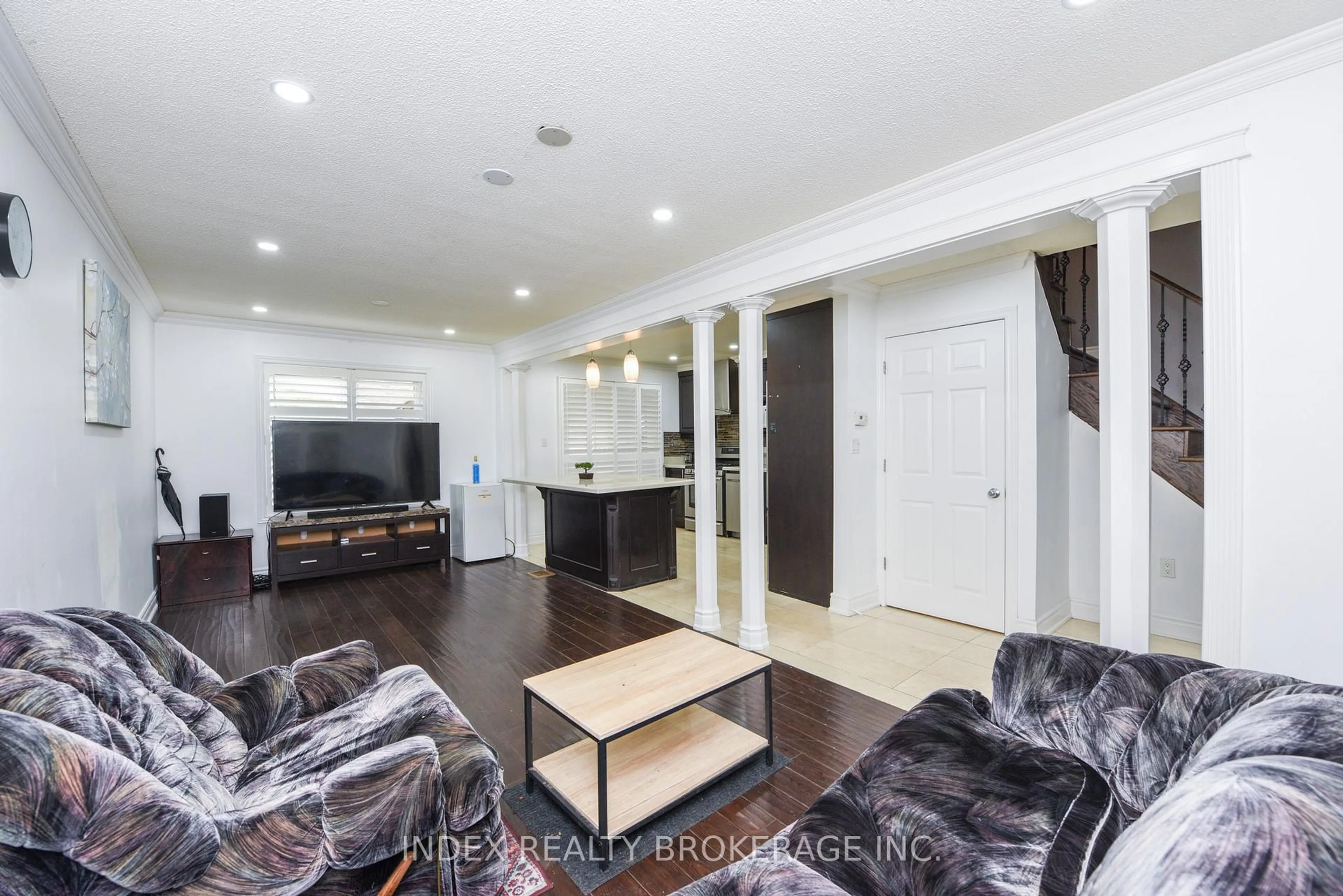 Living room with furniture, wood/laminate floor for 203 Richvale Dr, Brampton Ontario L6Z 4R6
