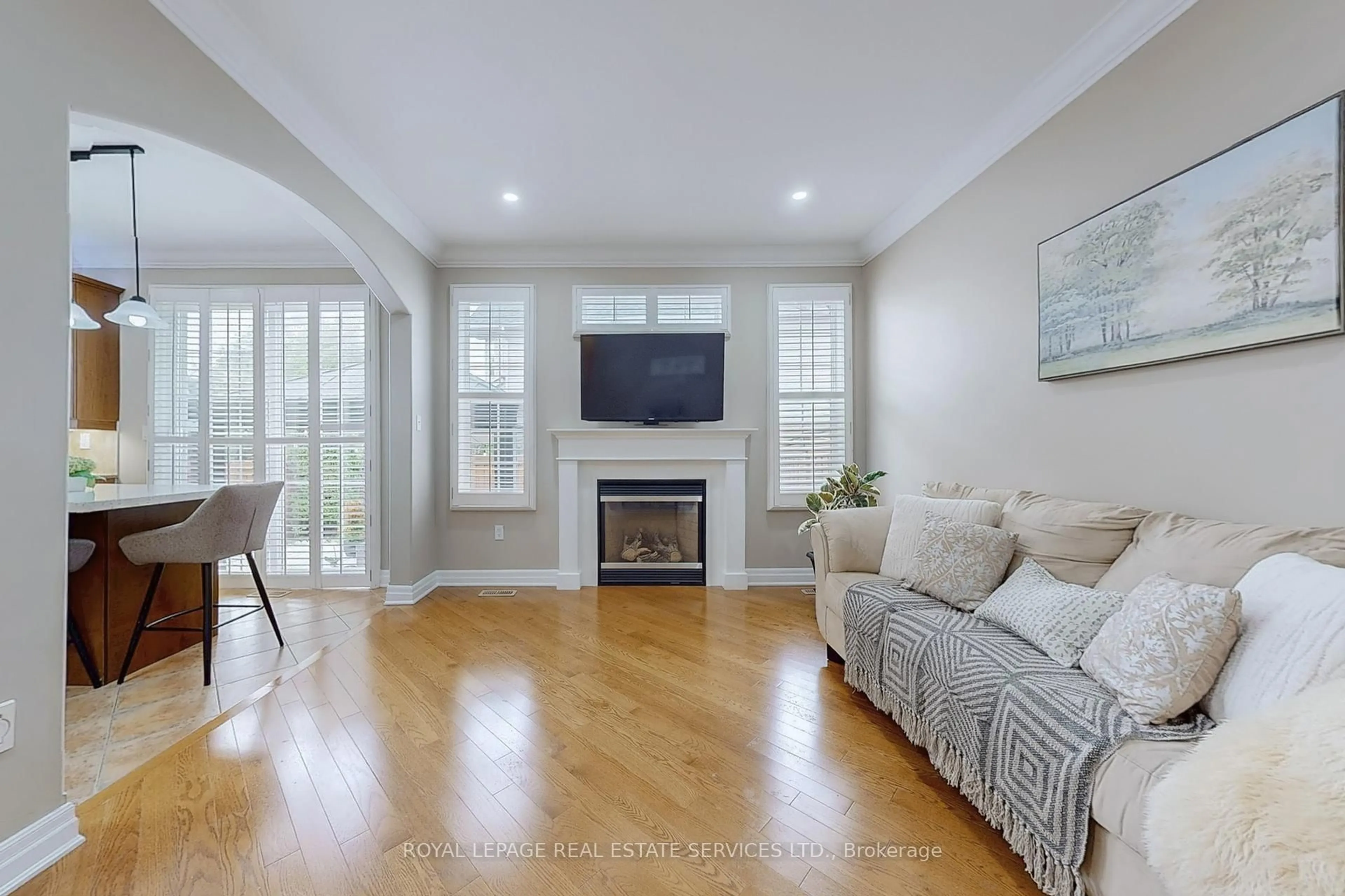 Living room with furniture, wood/laminate floor for 659 Hood Terr, Milton Ontario L9T 0H1