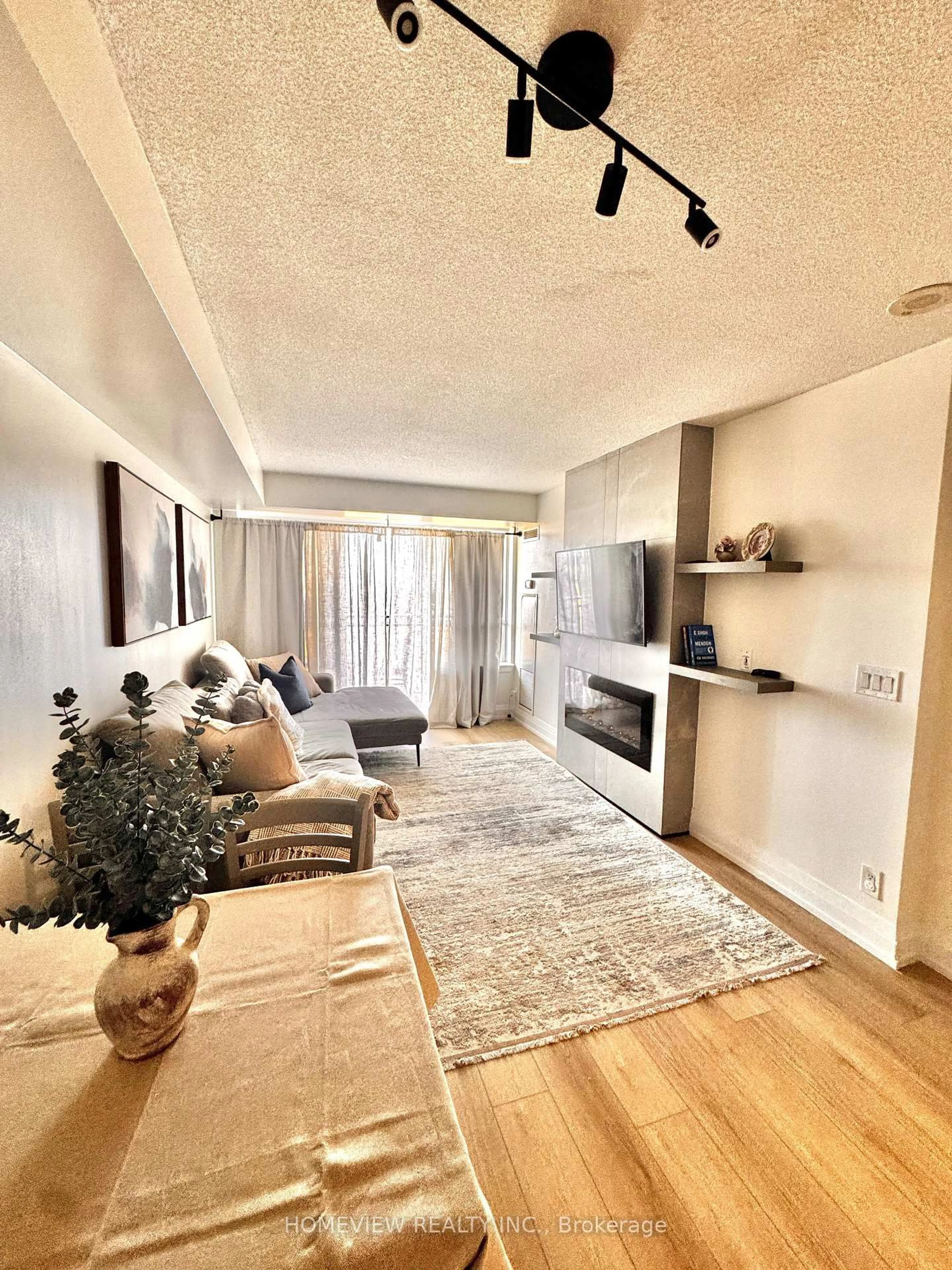 Living room with furniture, wood/laminate floor for 1070 Sheppard Ave #1211, Toronto Ontario M3J 0G8
