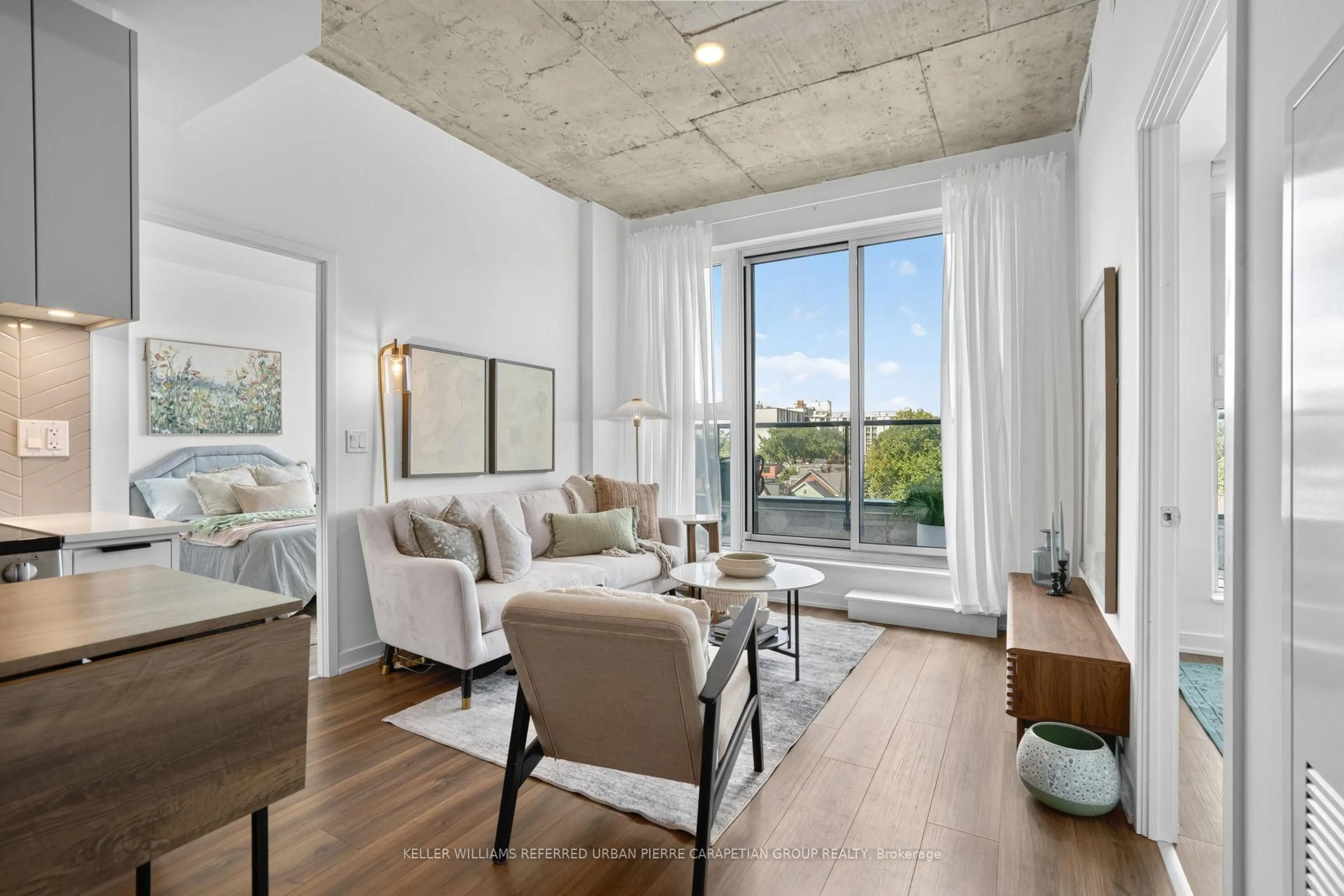 Living room with furniture, cement floor for 57 Brock Ave #503, Toronto Ontario M3H 3N2