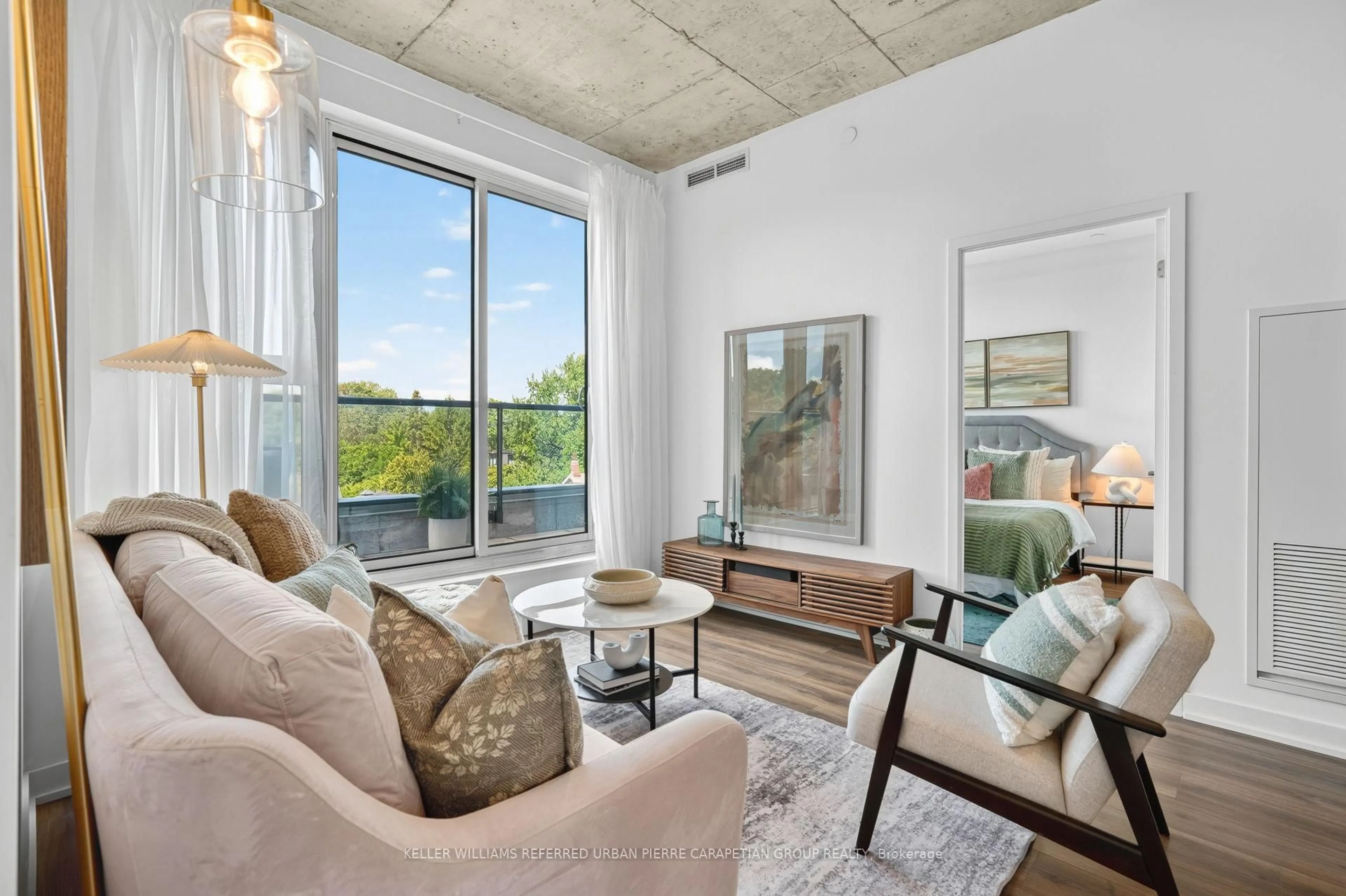 Living room with furniture, cement floor for 57 Brock Ave #503, Toronto Ontario M3H 3N2