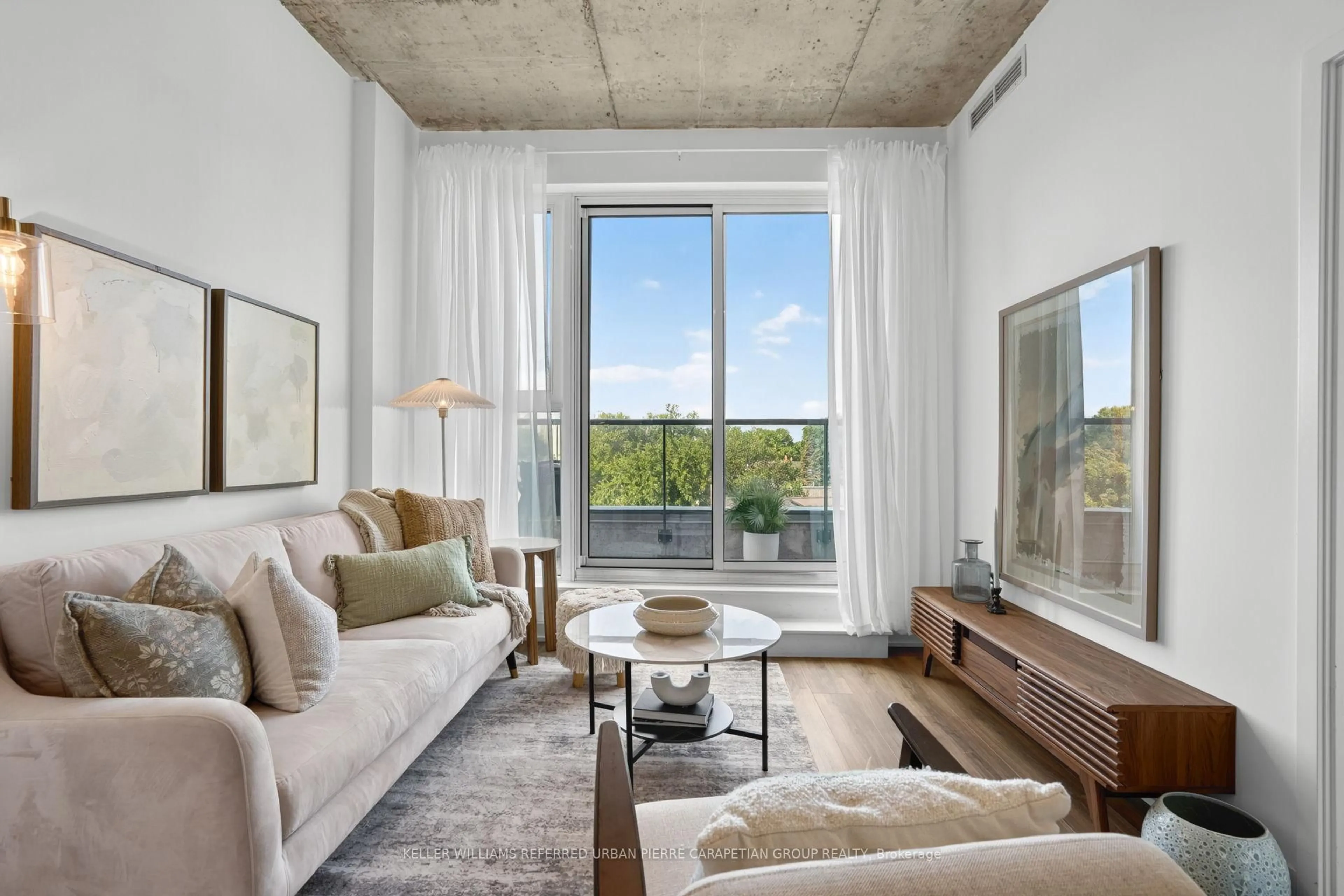Living room with furniture, cement floor for 57 Brock Ave #503, Toronto Ontario M3H 3N2