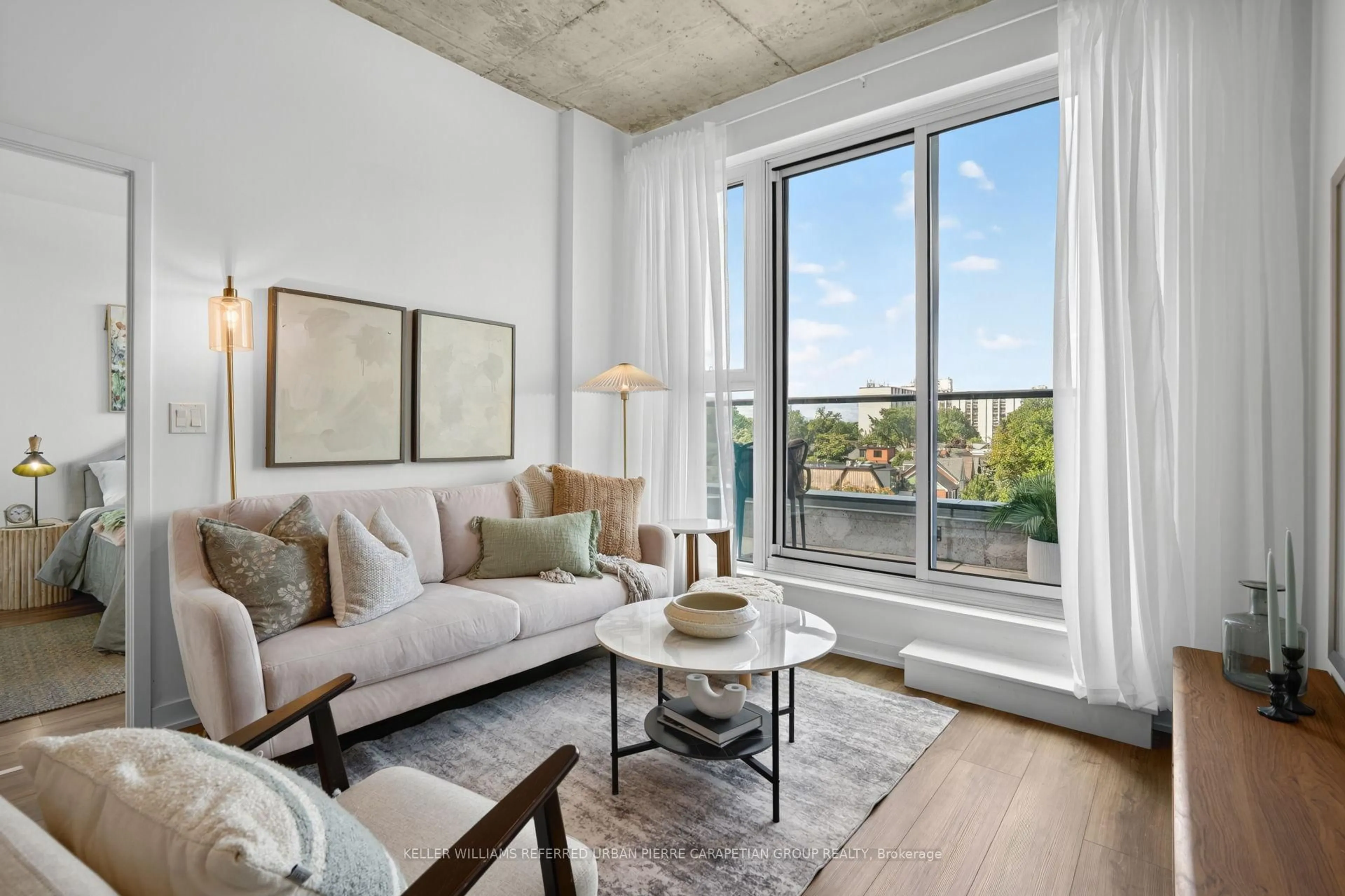 Living room with furniture, cement floor for 57 Brock Ave #503, Toronto Ontario M3H 3N2