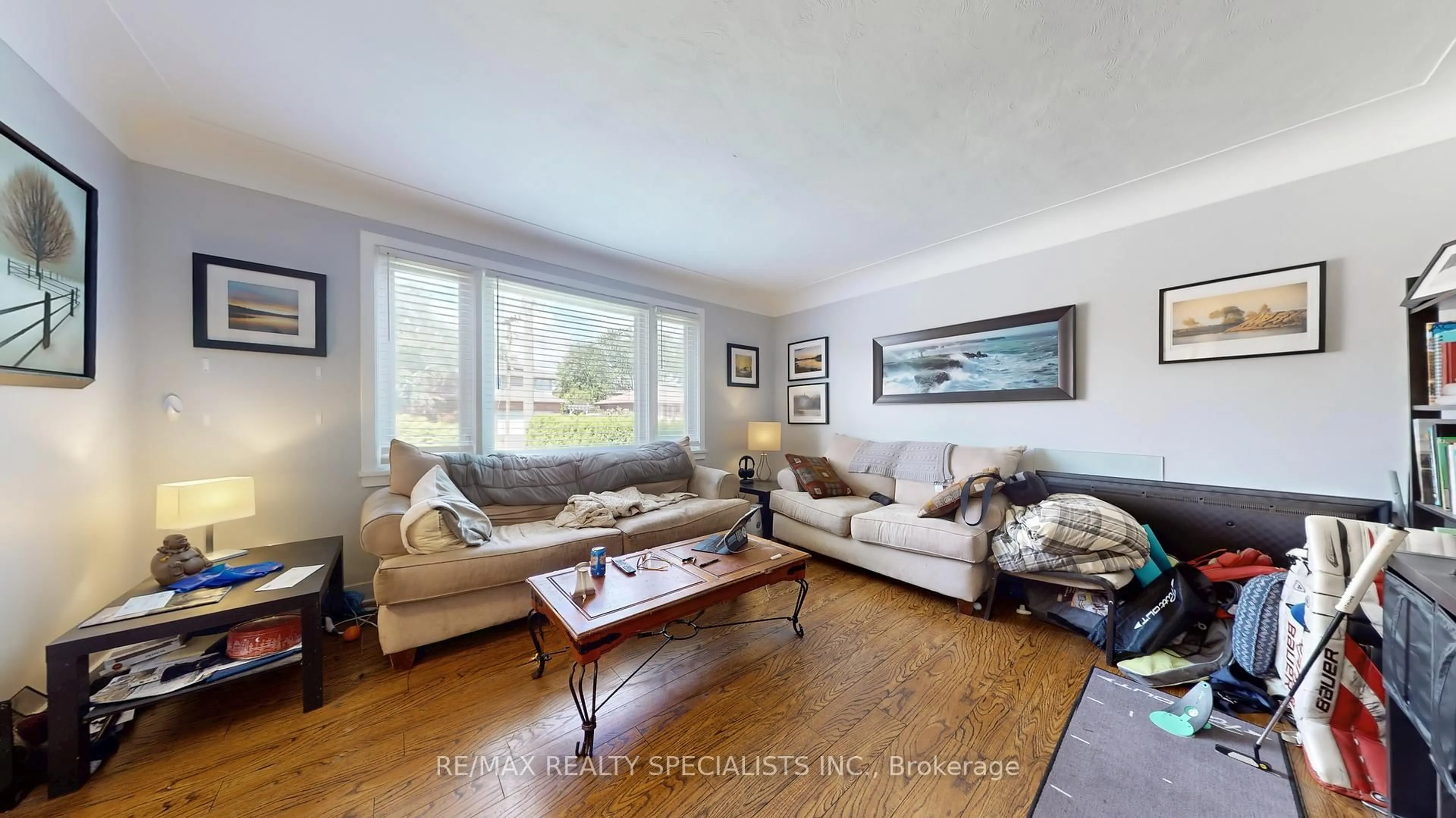 Living room with furniture, wood/laminate floor for 1306 Leighland Rd, Burlington Ontario L7R 3S5