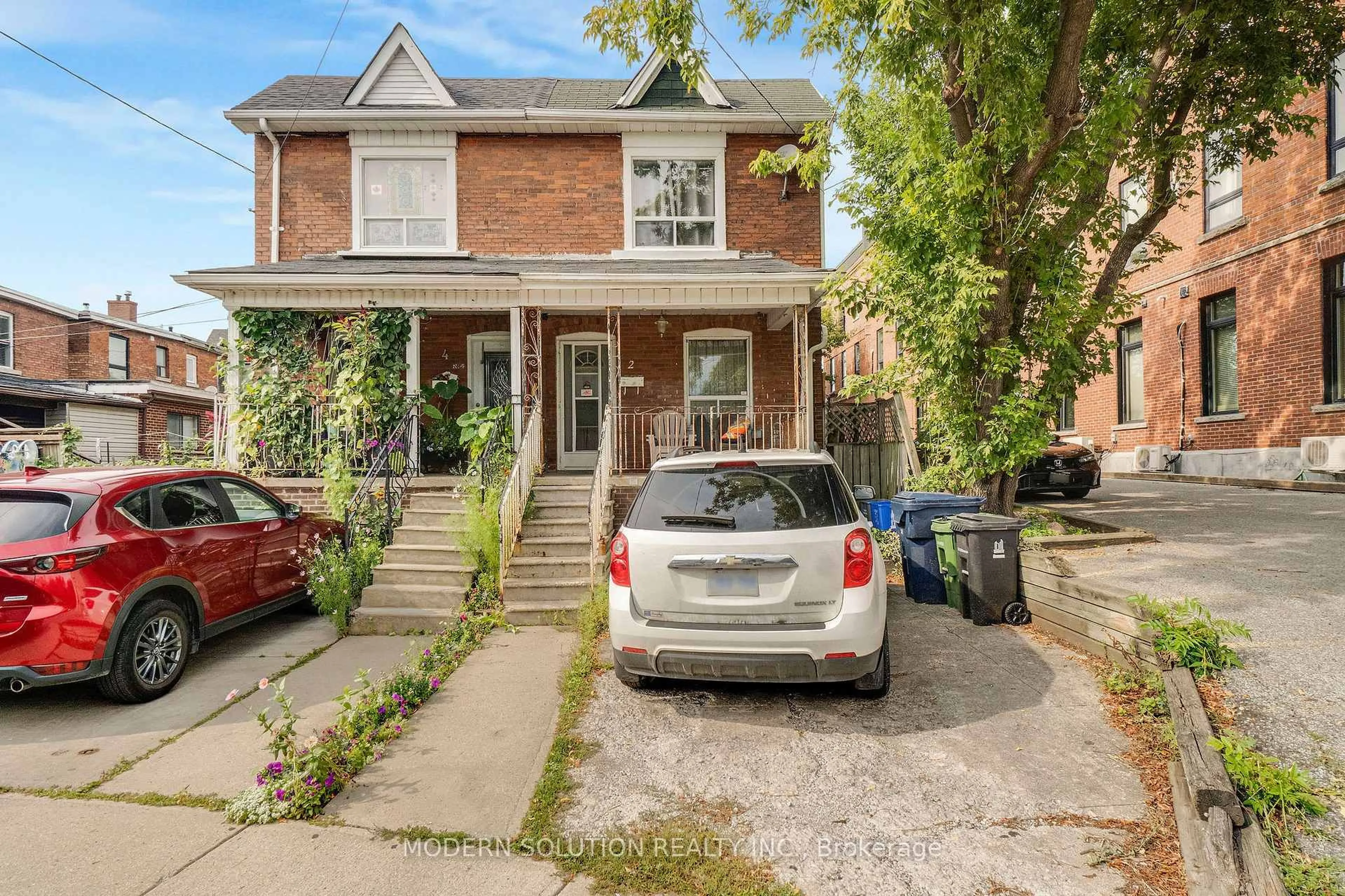 Home with brick exterior material, street for 2 Rockwell Ave, Toronto Ontario M6N 1N3