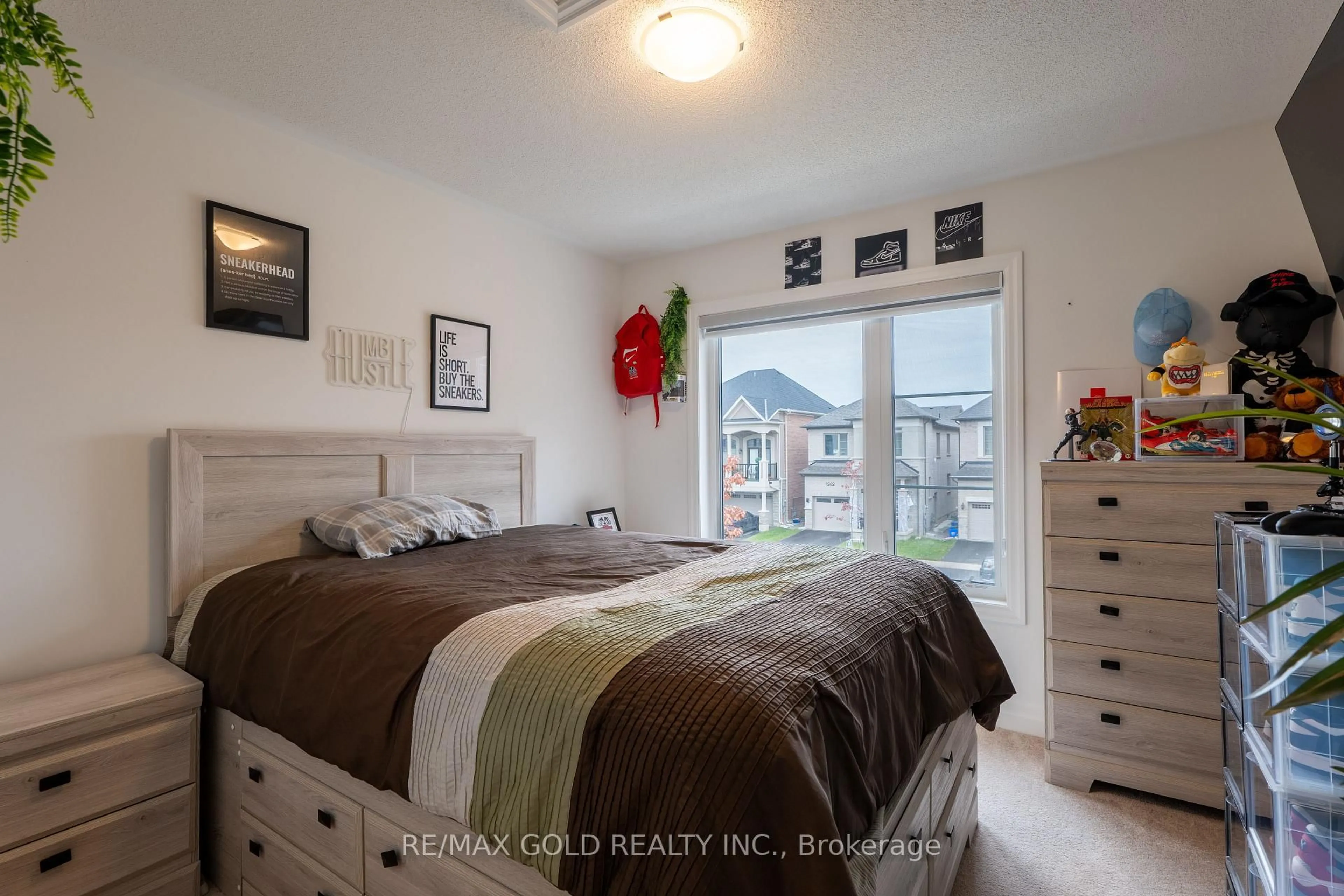 Bedroom with bed, wood/laminate floor for 1257 Trudeau Dr, Milton Ontario L9T 6H8
