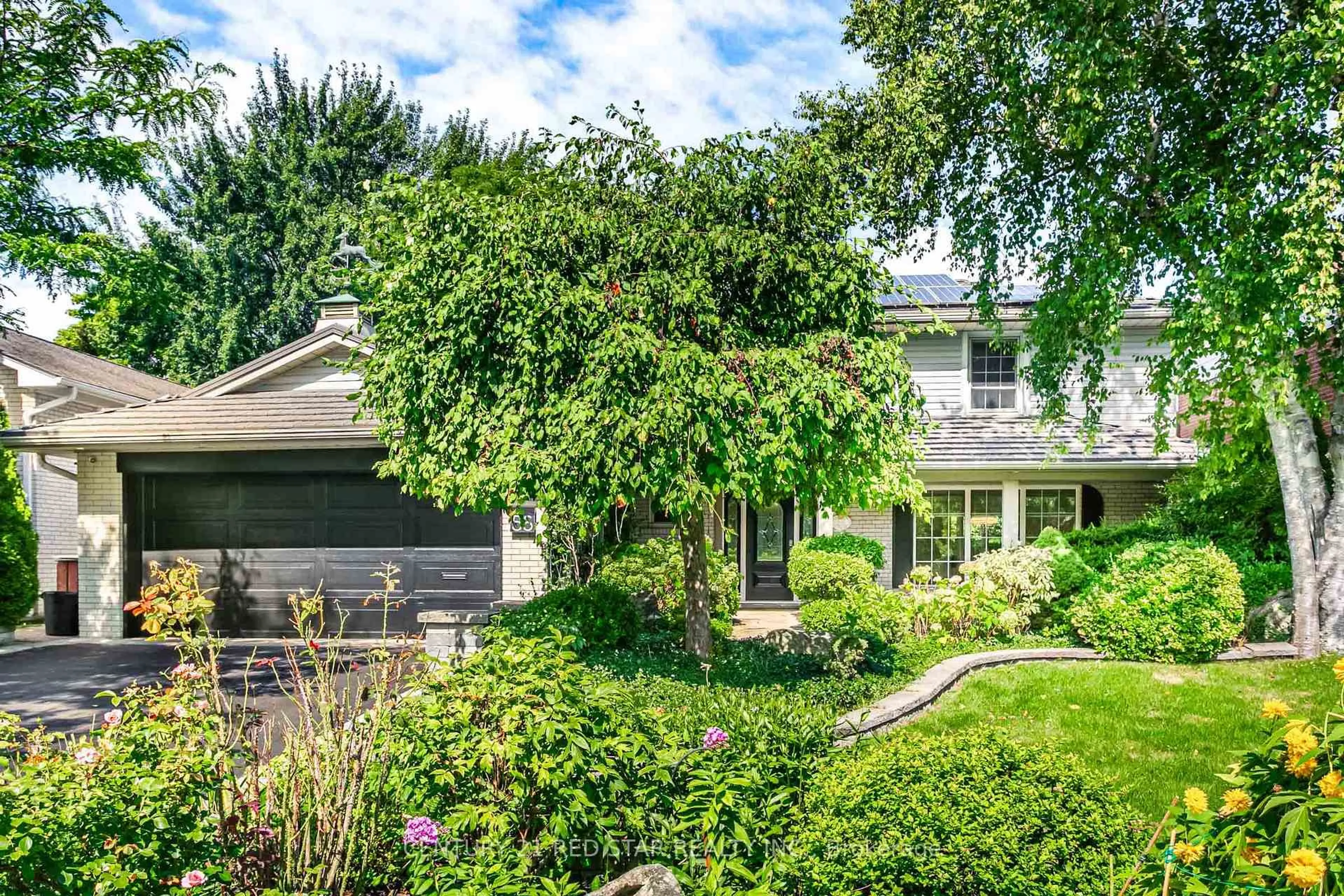 Home with brick exterior material, street for 56 Silverthorne Bush Dr, Toronto Ontario M9C 2X8