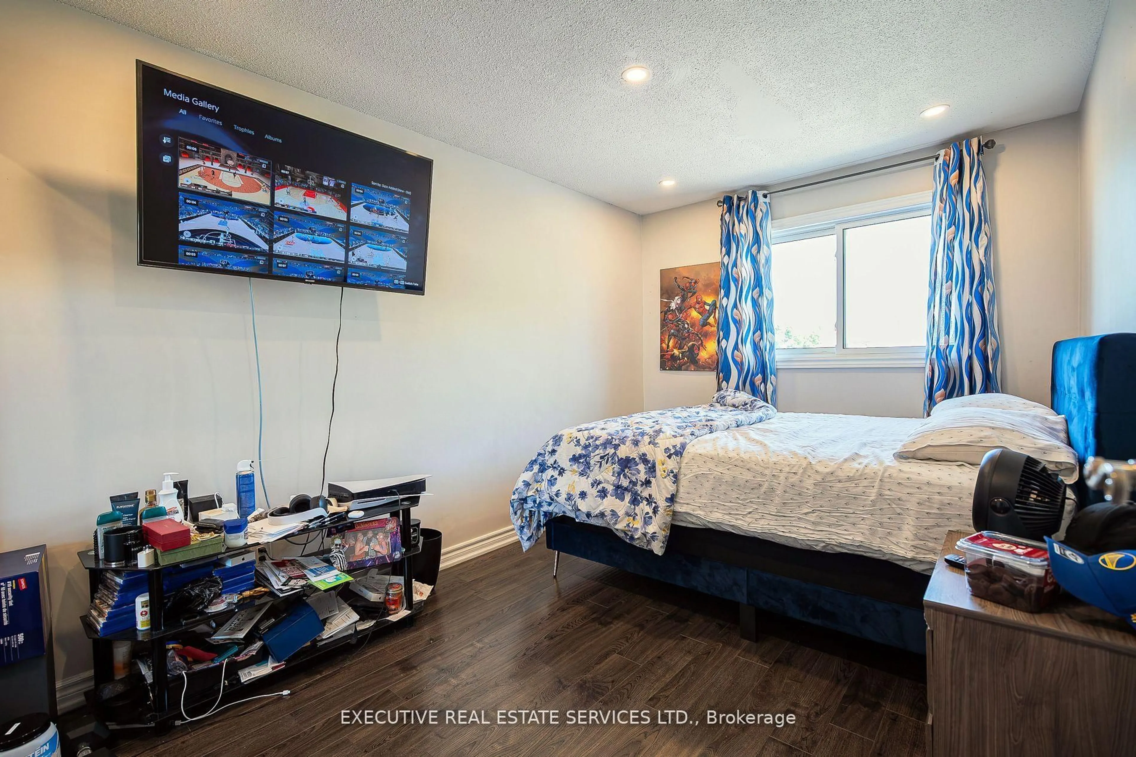 Bedroom with bed, wood/laminate floor for 4 Simmons Blvd, Brampton Ontario L6V 3V5