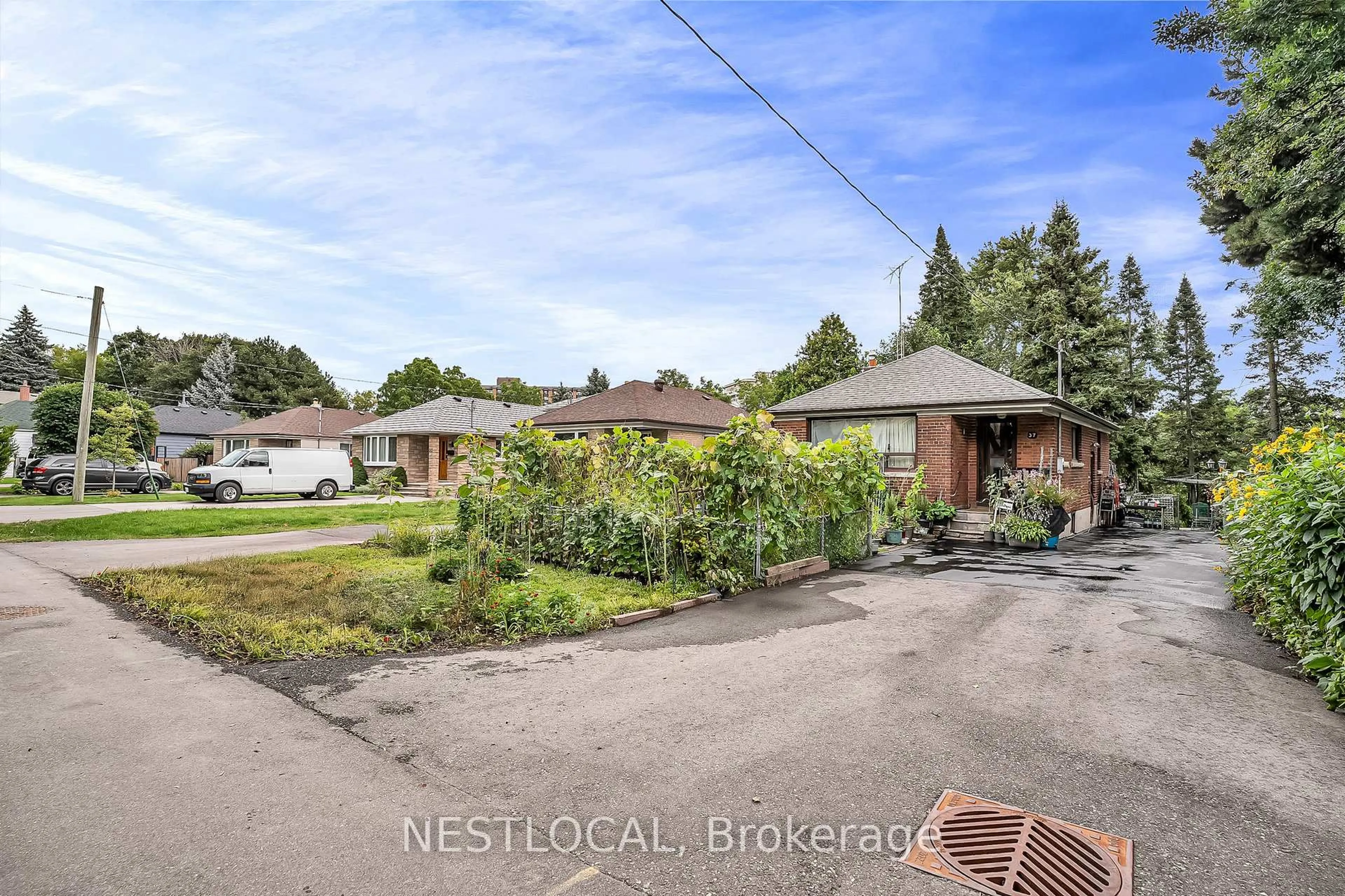 A pic from outside/outdoor area/front of a property/back of a property/a pic from drone, street for 37 Enfield Ave, Toronto Ontario M8W 1T6