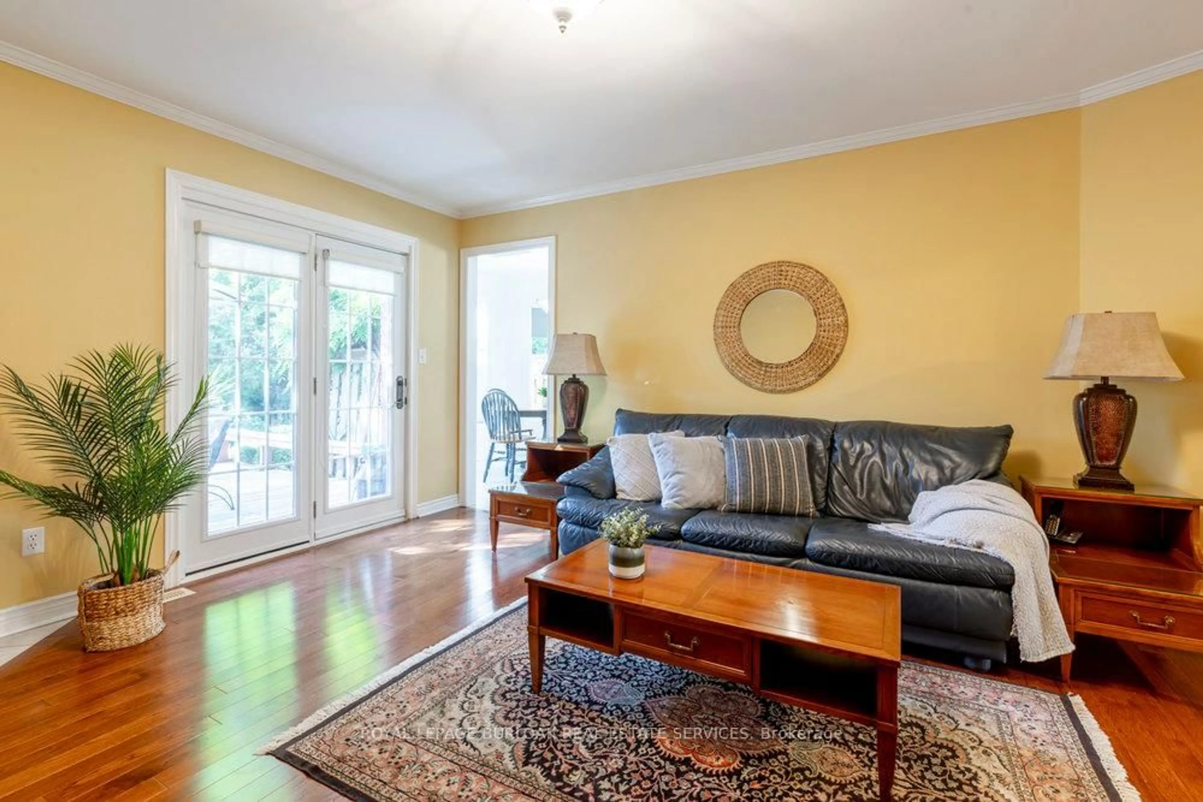 Living room with furniture, wood/laminate floor for 1142 Augustus Dr, Burlington Ontario L7S 2K6