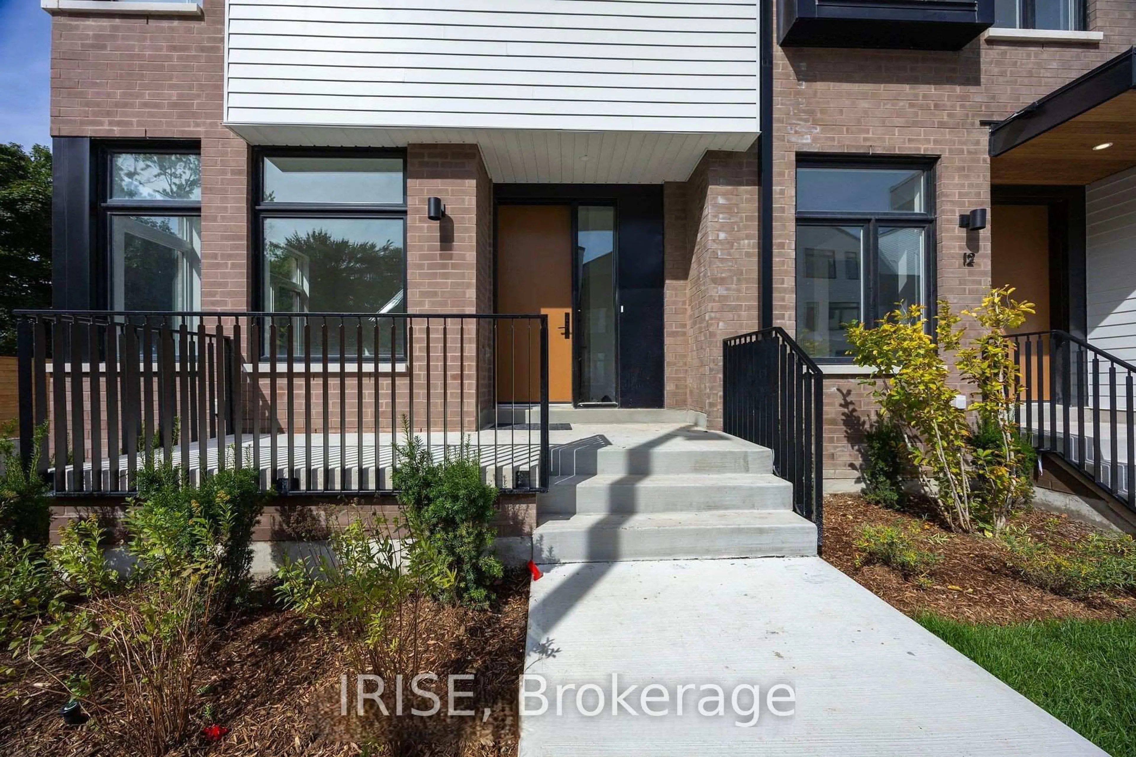 Home with brick exterior material, street for 40 Lou Parsons Way #55, Mississauga Ontario L5H 0B2