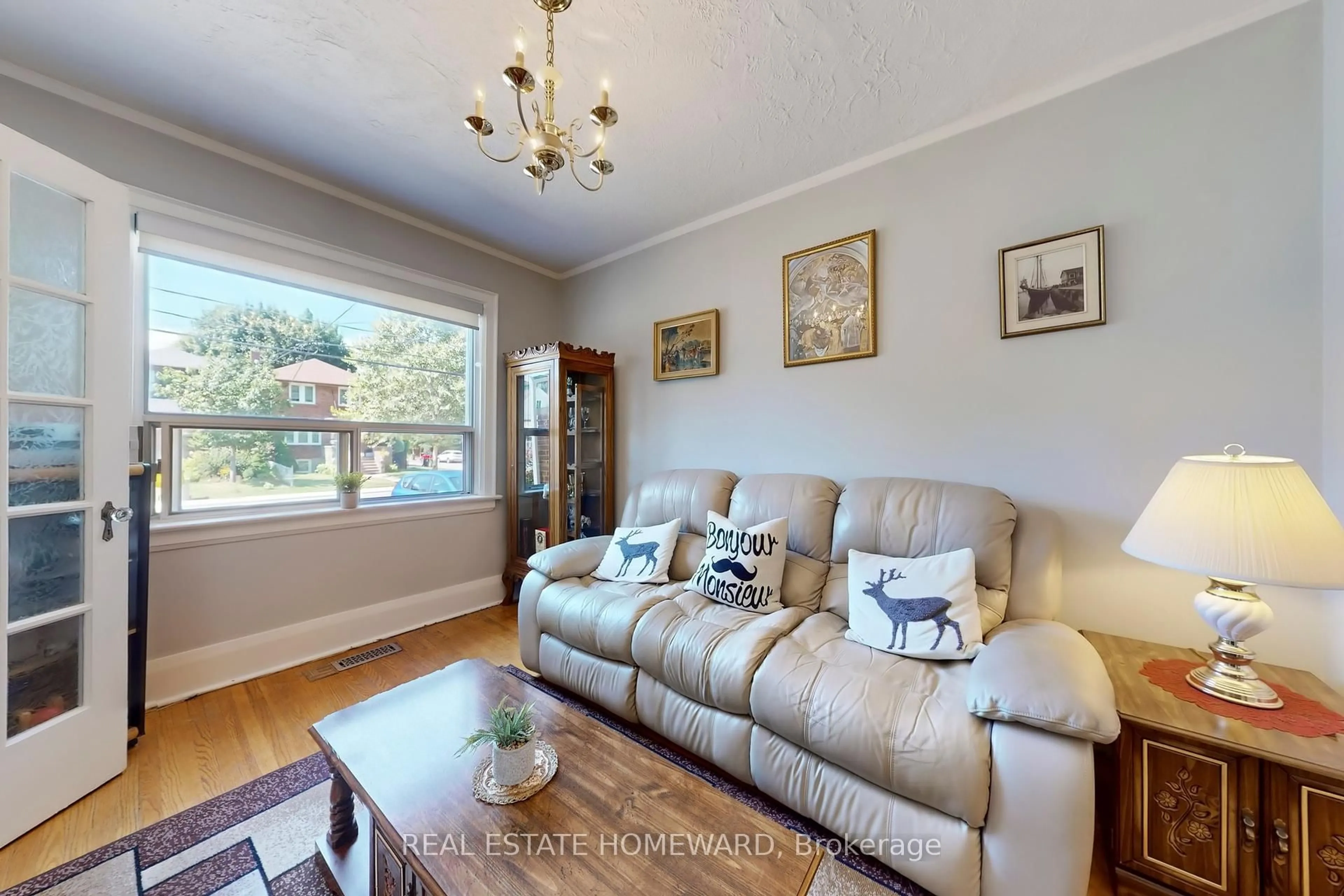 Living room with furniture, wood/laminate floor for 87 Guestville Ave, Toronto Ontario M6N 4N5