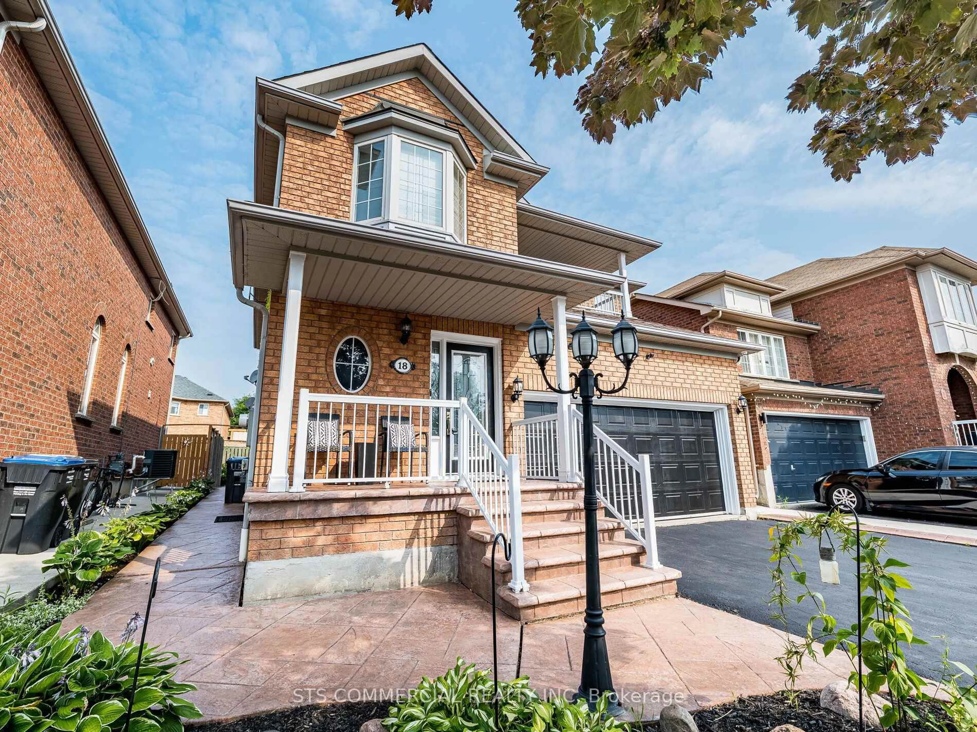 Home with brick exterior material, street for 18 Queen Mary Dr, Brampton Ontario L7A 1X8