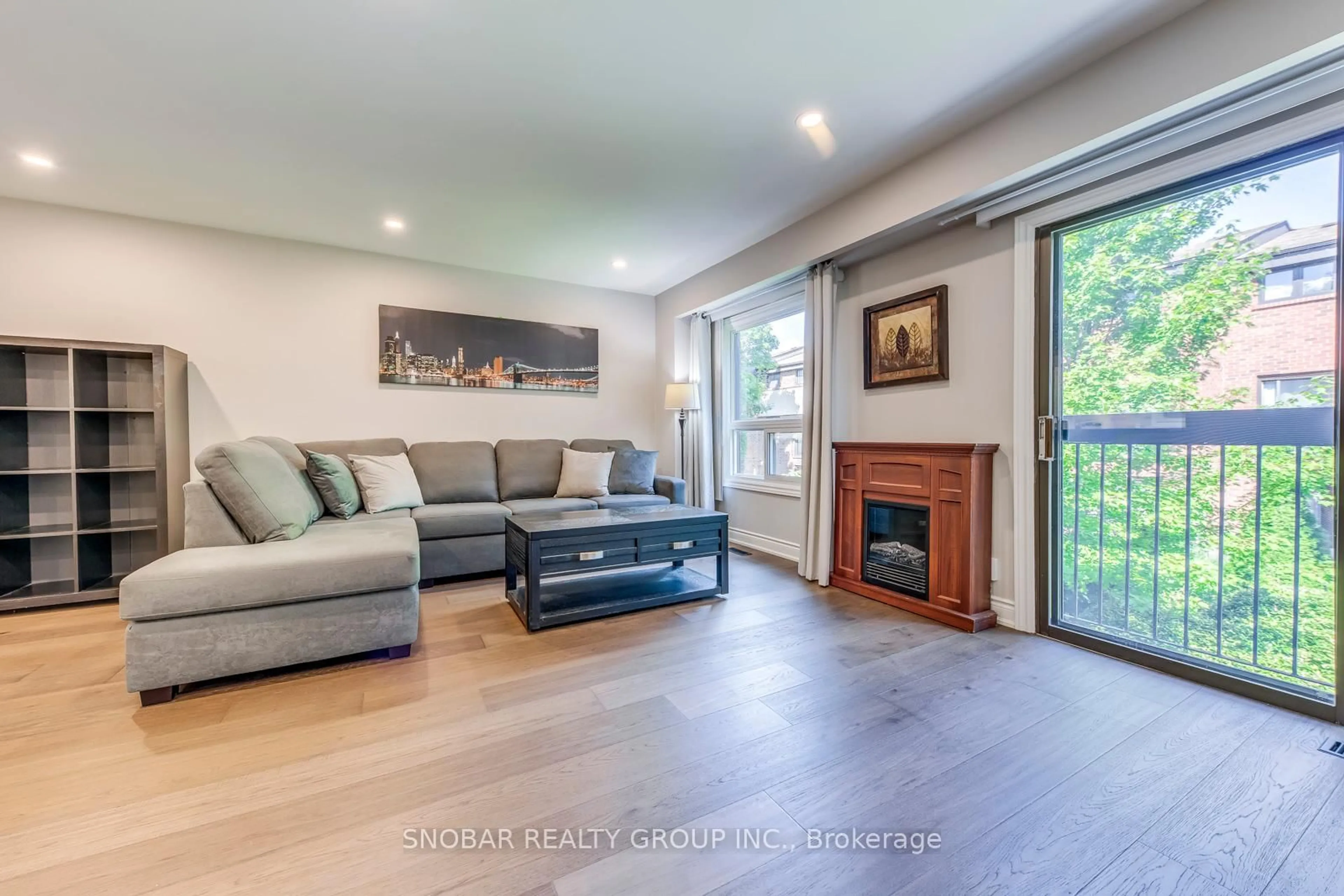 Living room with furniture, wood/laminate floor for 35 Maple Branch Path, Toronto Ontario M9P 3T4