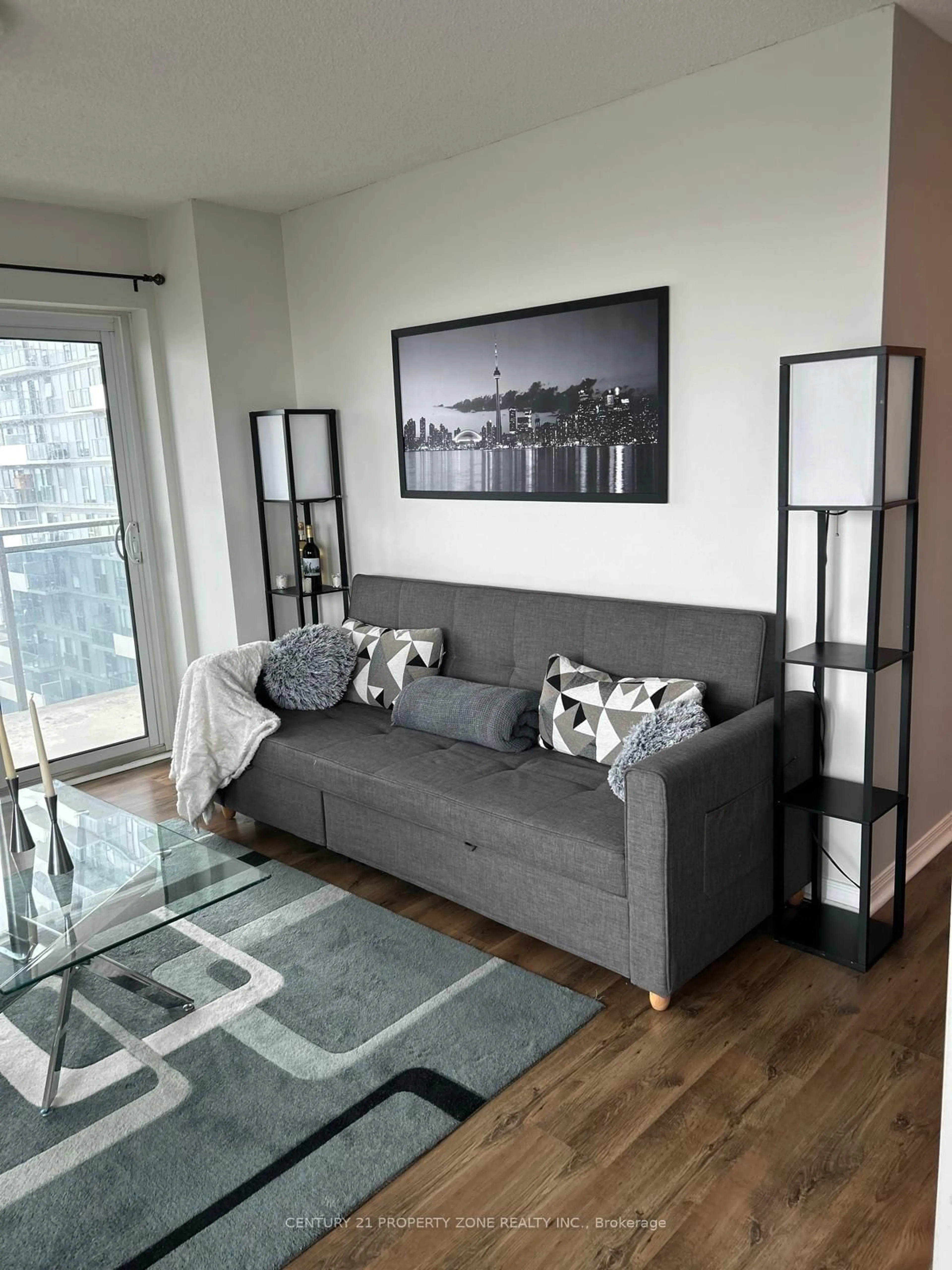 Living room with furniture, wood/laminate floor for 215 Queen St #1804, Brampton Ontario L6W 0A9