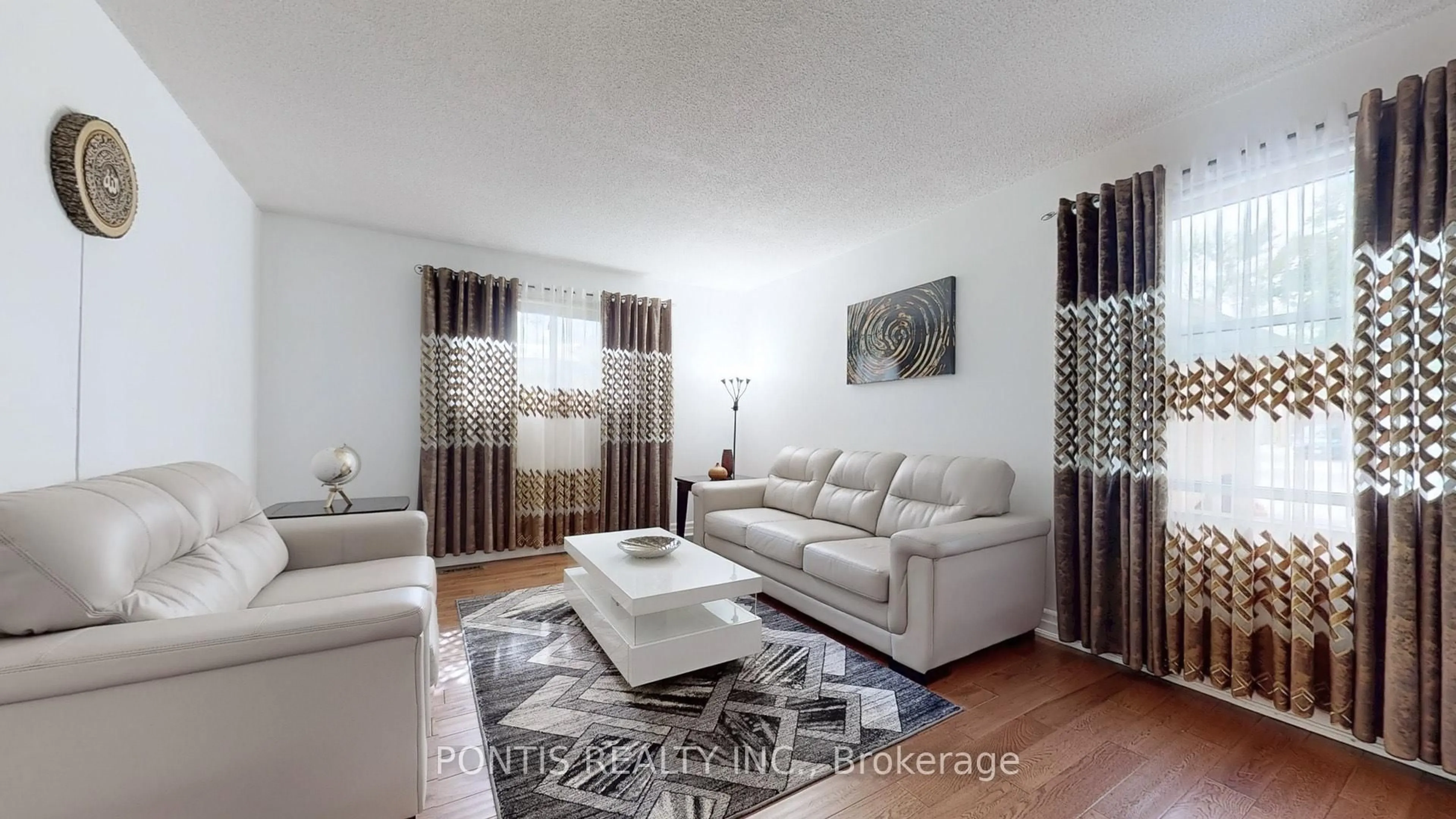 Living room with furniture, wood/laminate floor for 3014 OKA Rd, Mississauga Ontario L5N 3A5