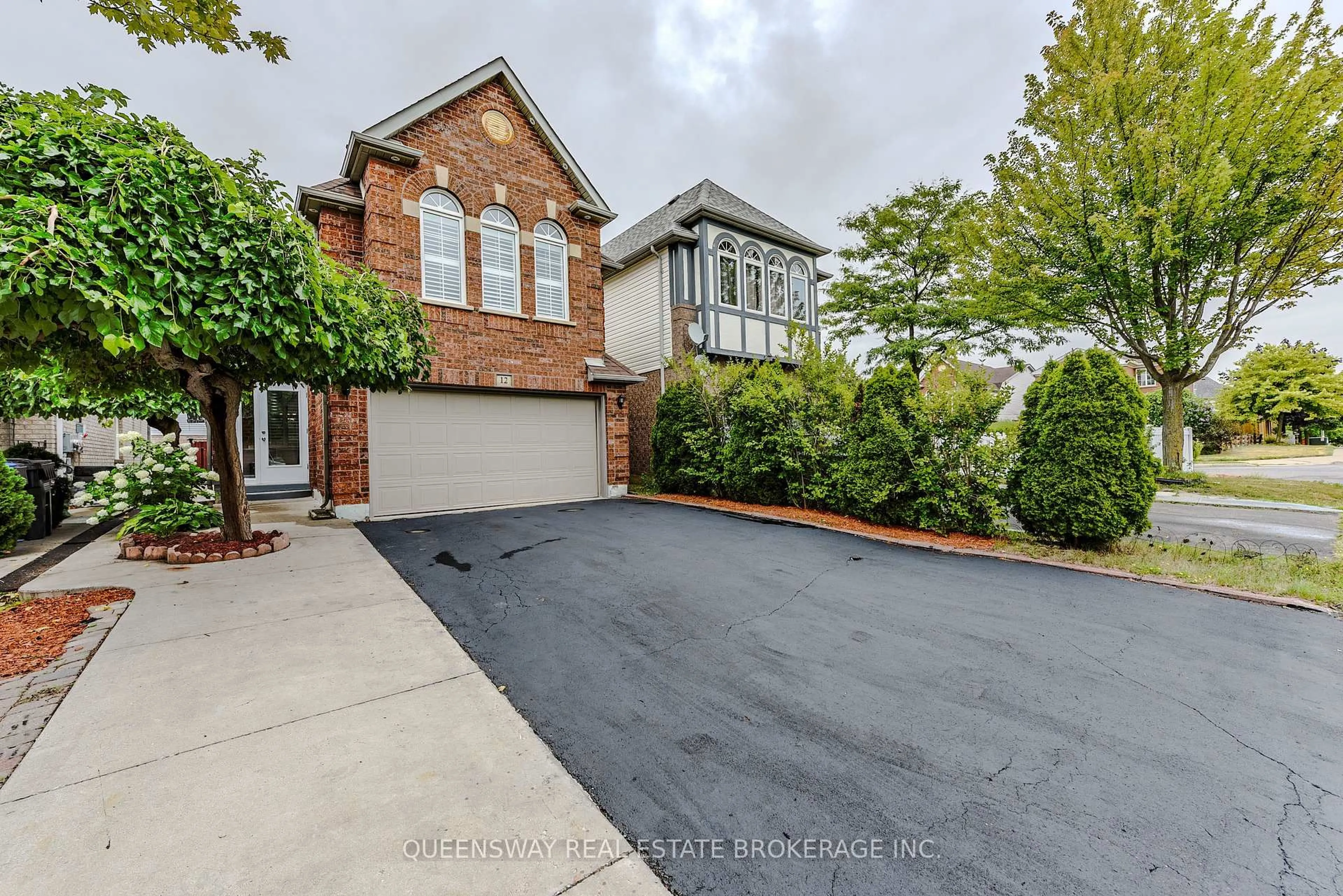 Home with brick exterior material, street for 12 Dandelion Rd, Brampton Ontario L6R 1X3