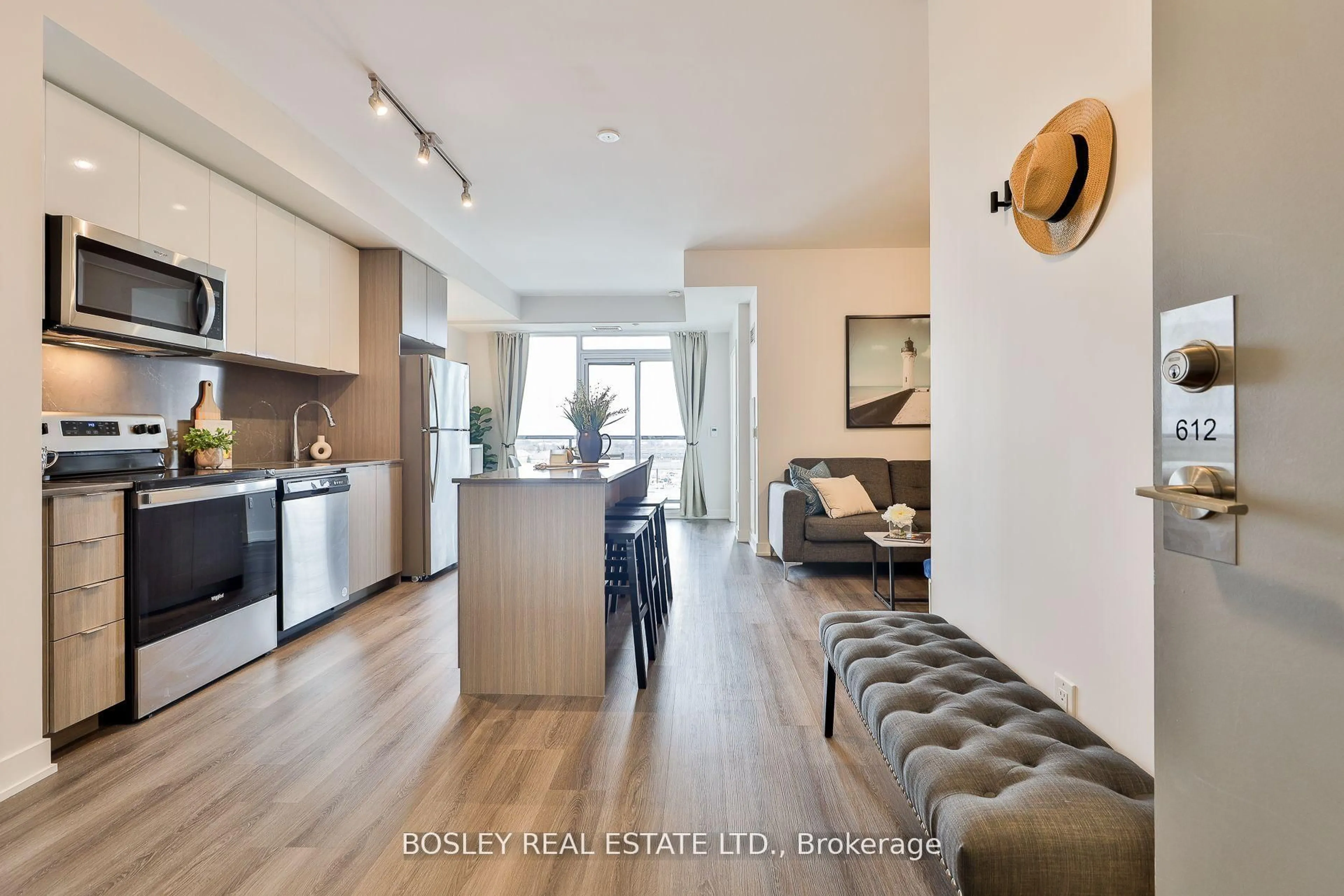 Open concept kitchen, wood/laminate floor for 859 The Queensway #612, Toronto Ontario M8Z 1N8