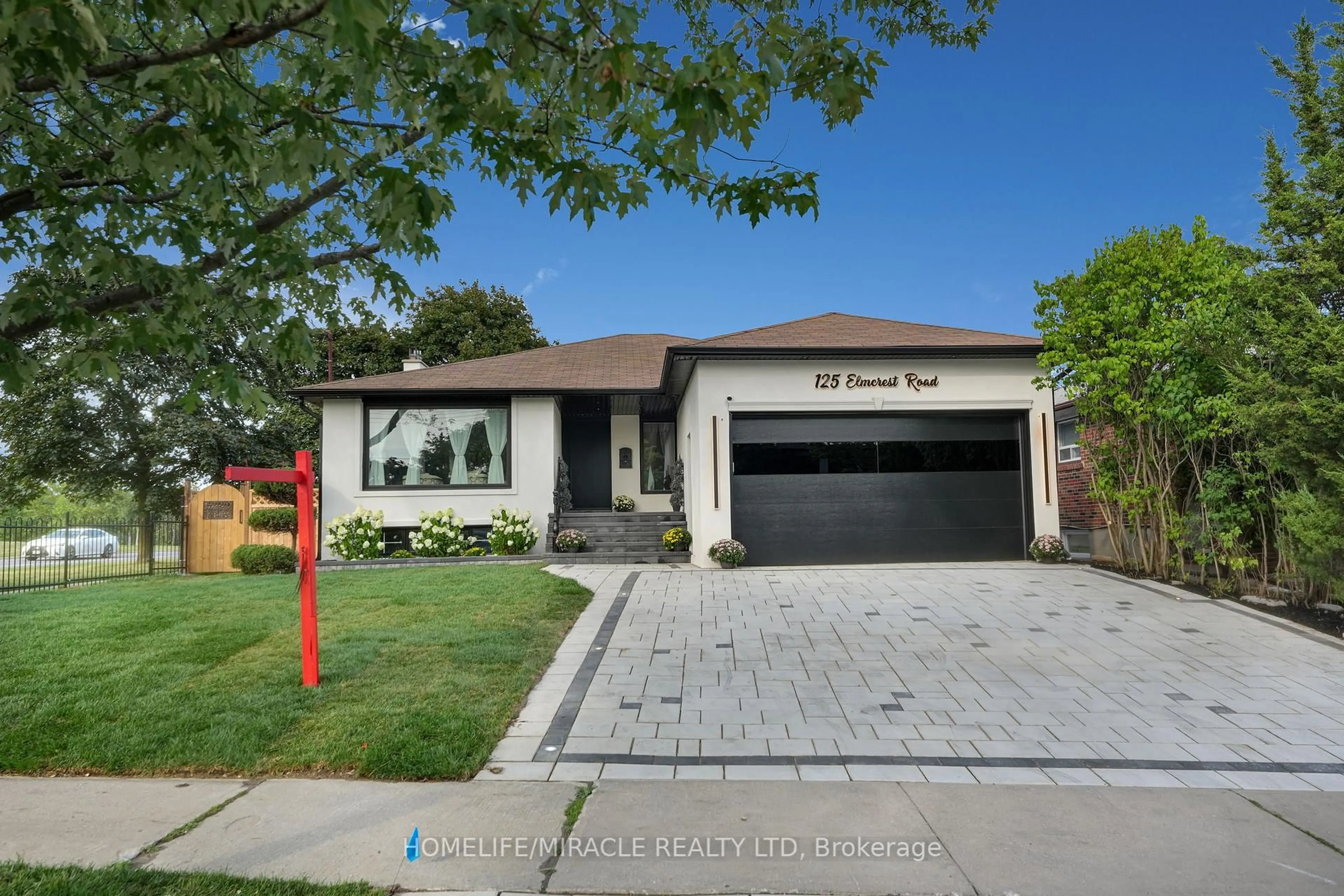 Home with brick exterior material, street for 125 Elmcrest Rd, Toronto Ontario M9C 3R5