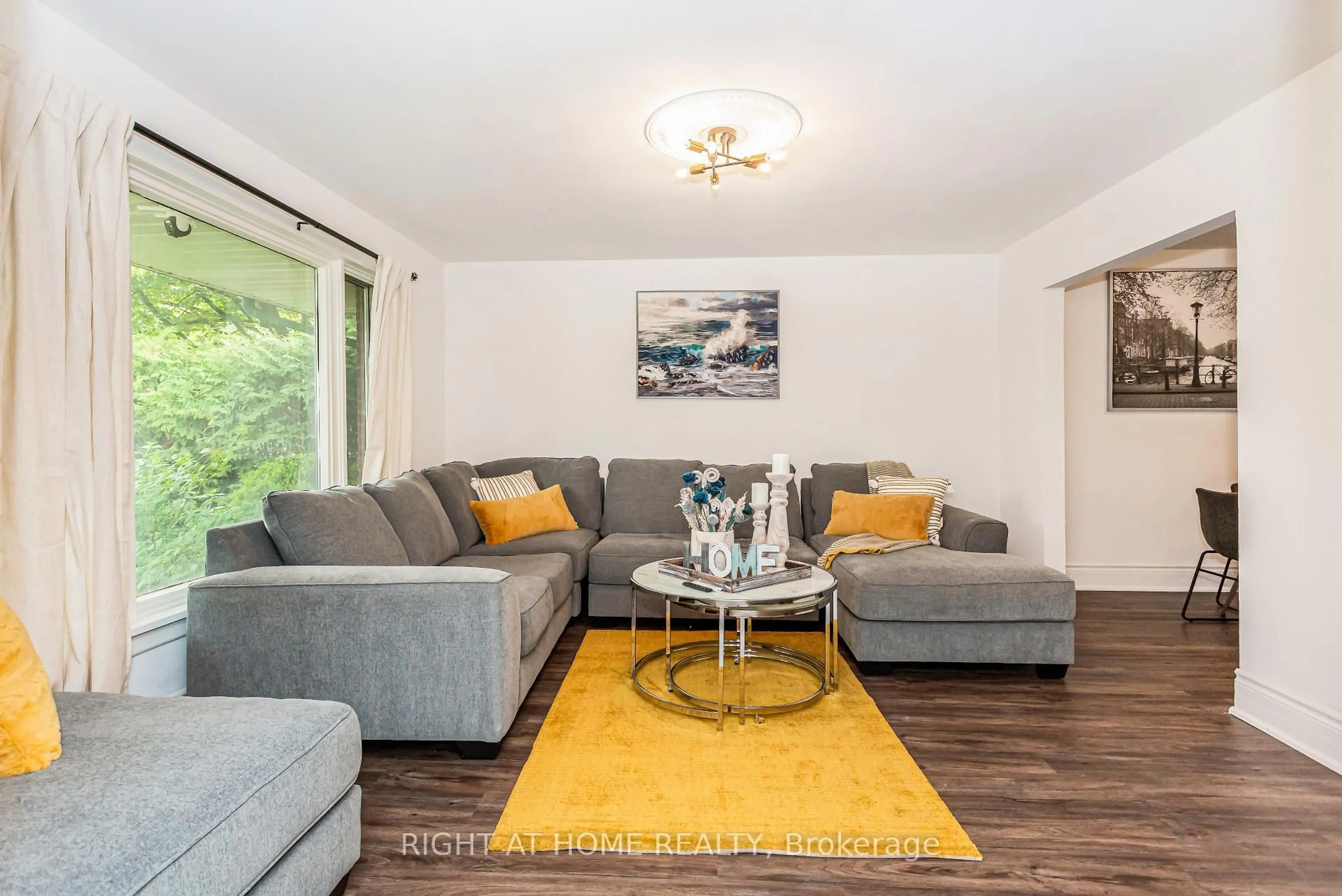Living room with furniture, wood/laminate floor for 411 Maplehurst Ave, Oakville Ontario L6L 4Y3