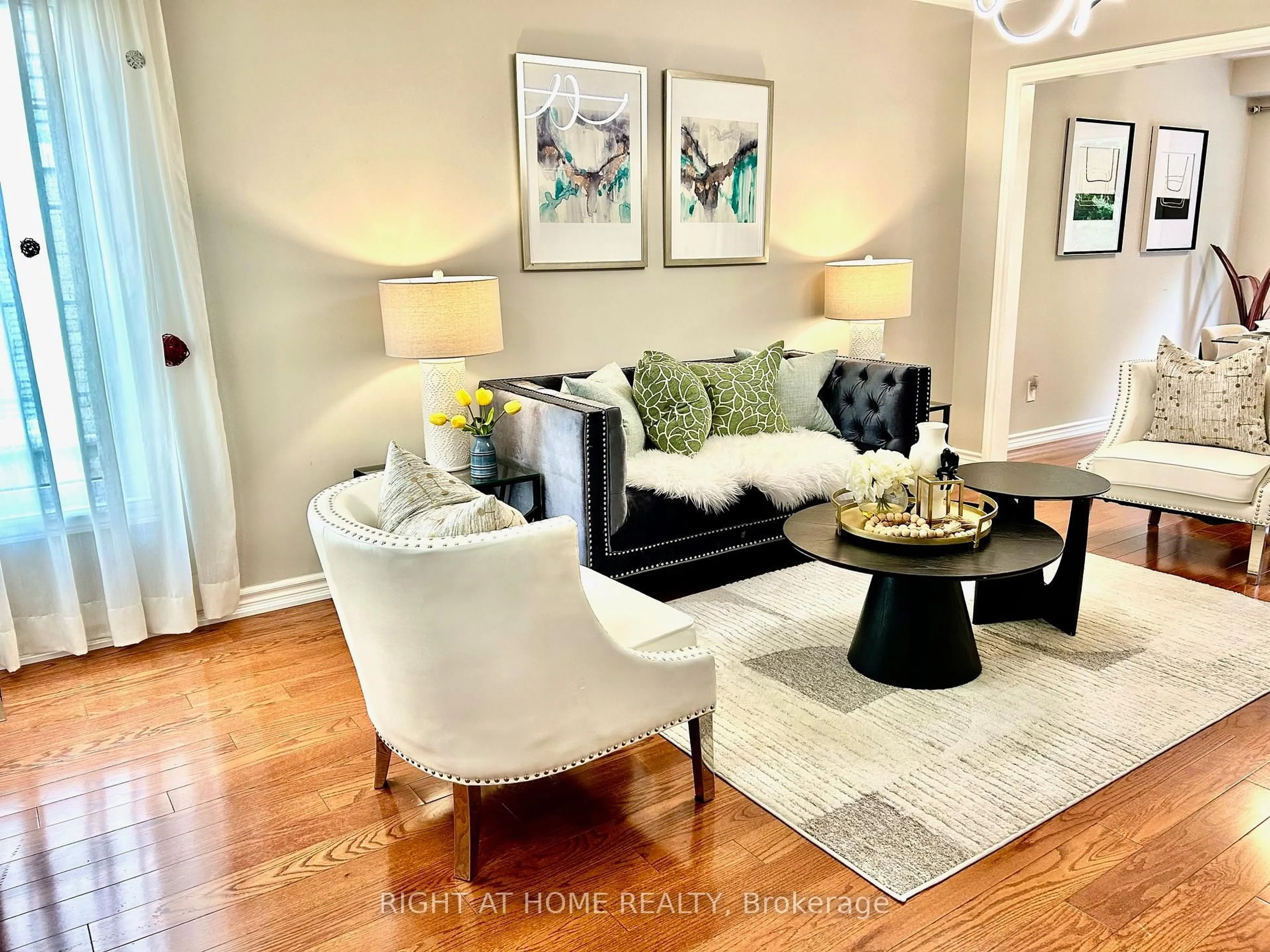 Living room with furniture, wood/laminate floor for 32 Heathcliffe Sq, Brampton Ontario L6S 5P7