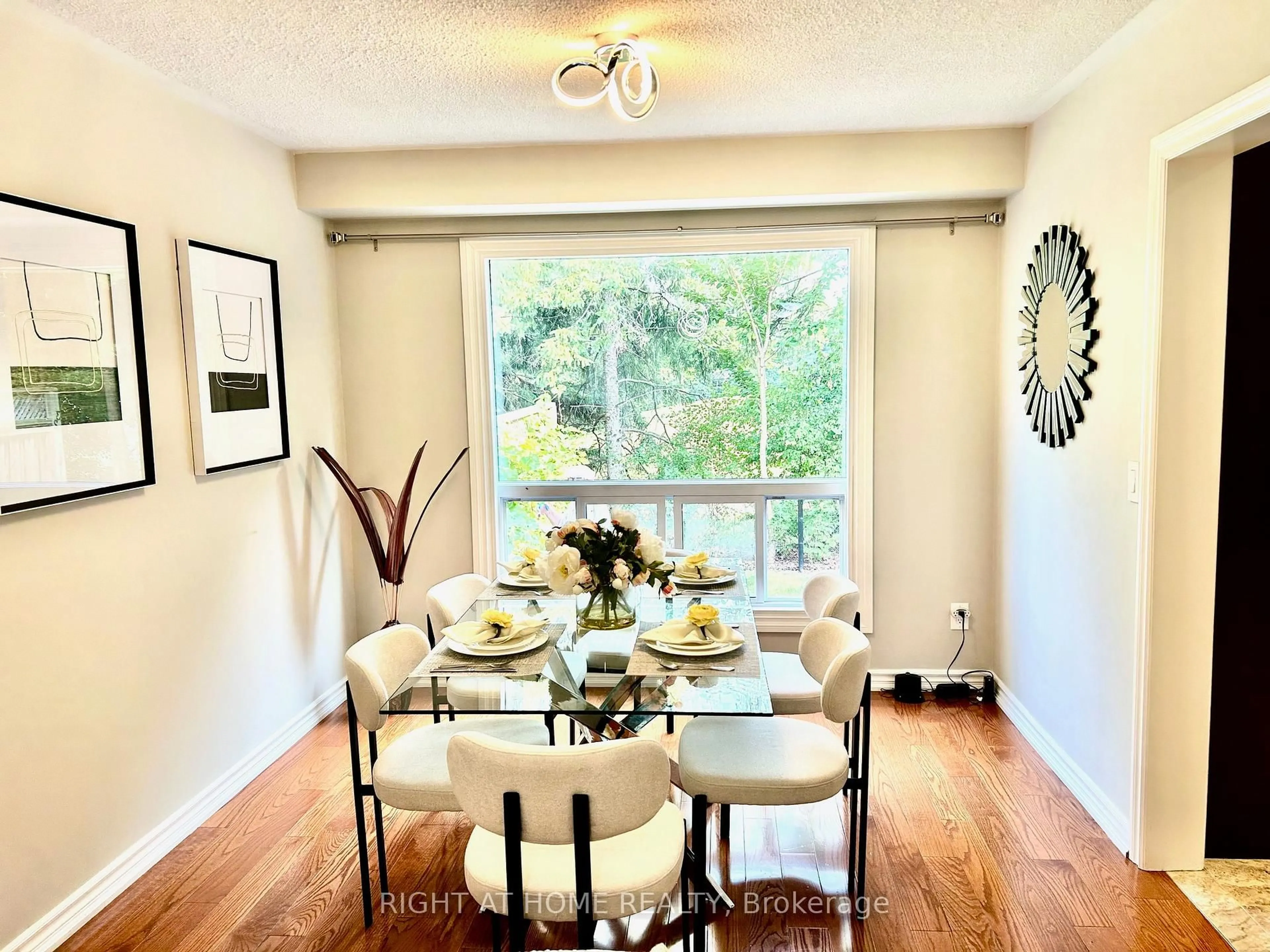 Dining room, wood/laminate floor for 32 Heathcliffe Sq, Brampton Ontario L6S 5P7