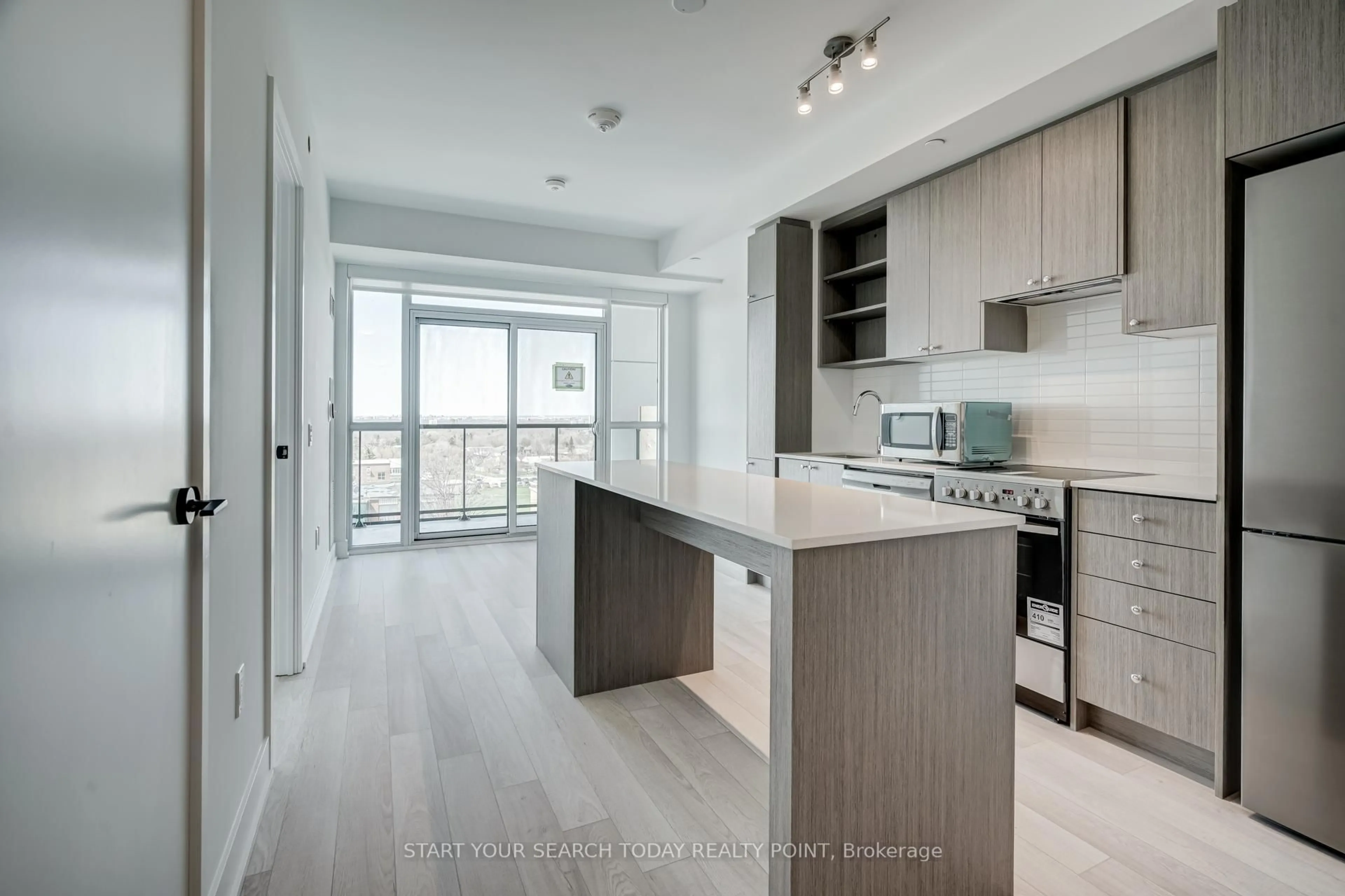 Open concept kitchen, wood/laminate floor for 50 George Butchart Dr #502, Toronto Ontario M3M 2H3