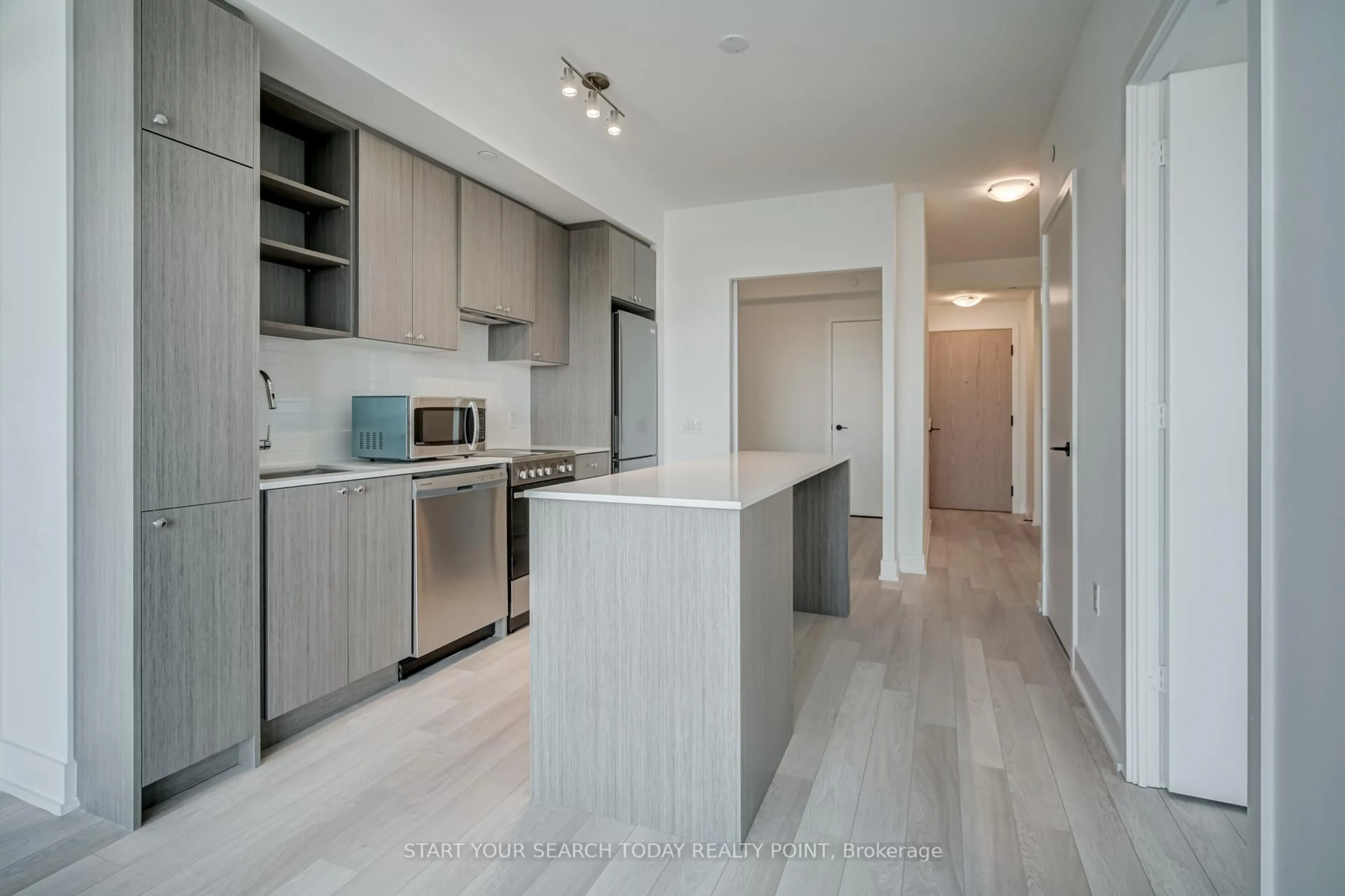 Open concept kitchen, wood/laminate floor for 50 George Butchart Dr #502, Toronto Ontario M3M 2H3