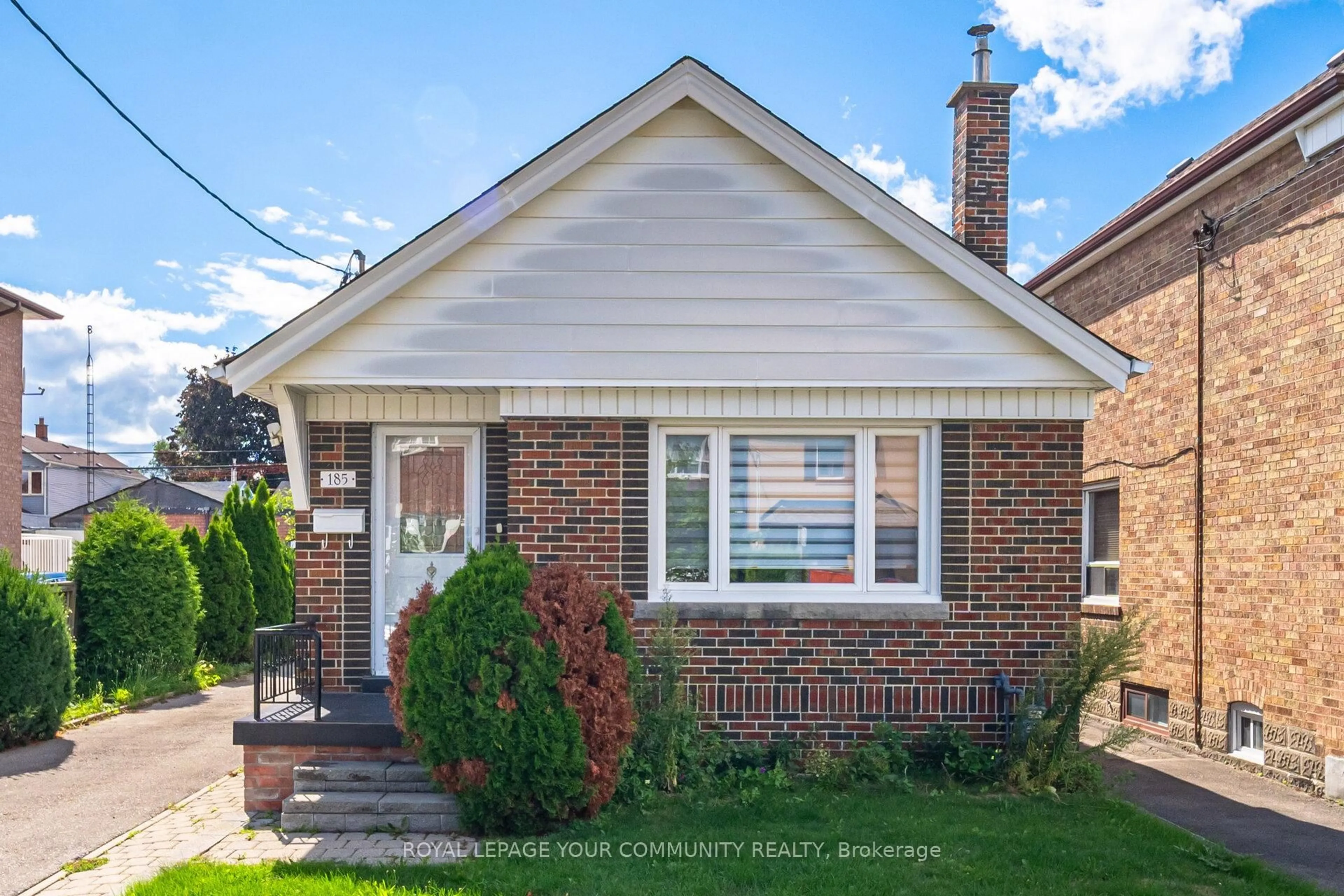 Home with brick exterior material, street for 185 Dunraven Dr, Toronto Ontario M6M 1H6