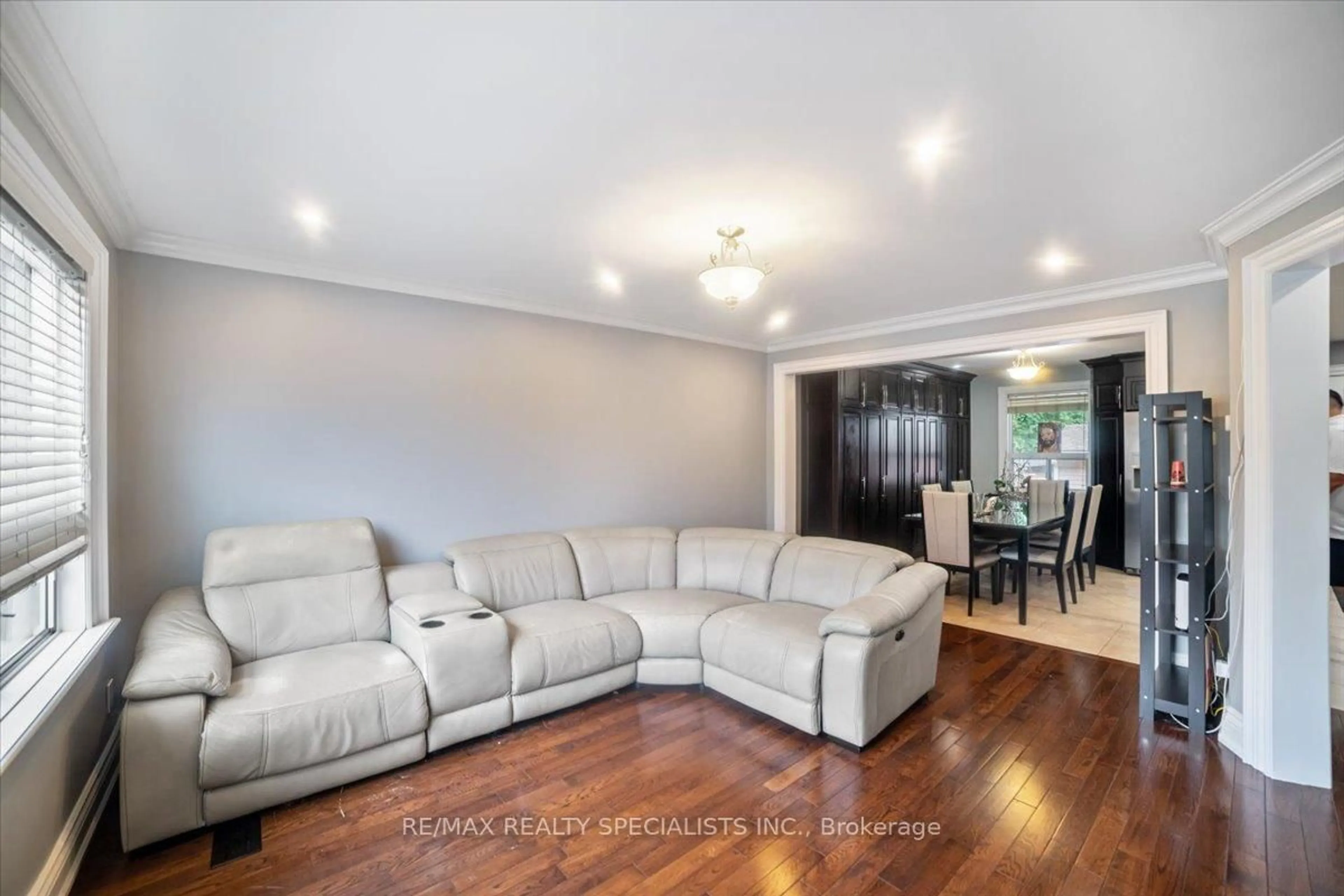 Living room with furniture, wood/laminate floor for 26 Edinborough Crt, Toronto Ontario M6N 2E8