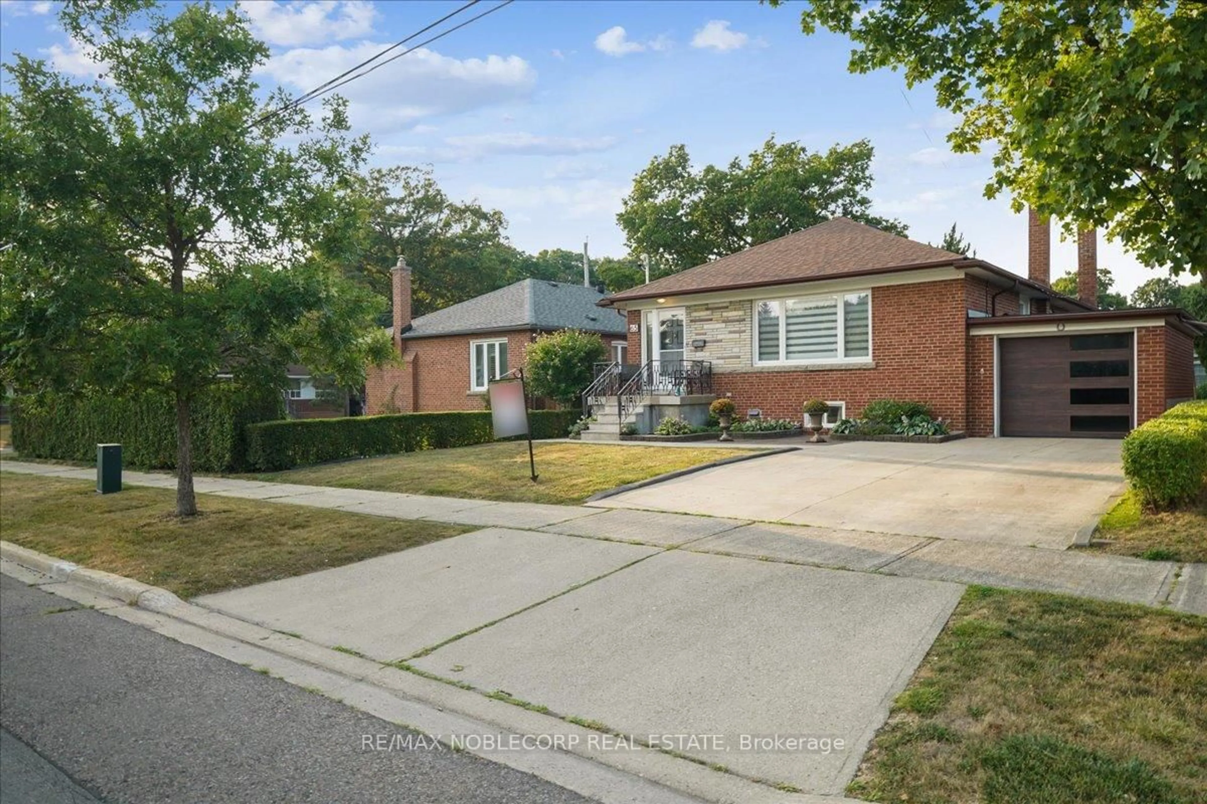 Home with brick exterior material, street for 65 Exbury Rd, Toronto Ontario M3M 1P9
