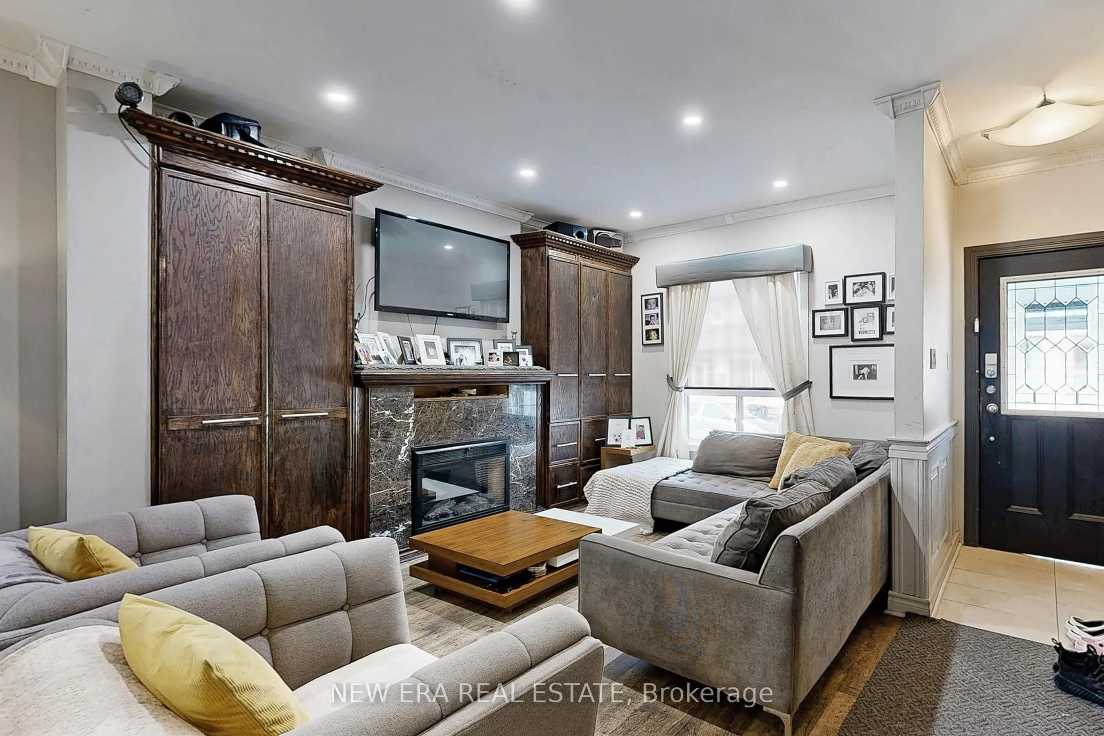 Living room with furniture, wood/laminate floor for 53 Burnfield Ave, Toronto Ontario M6G 1Y4