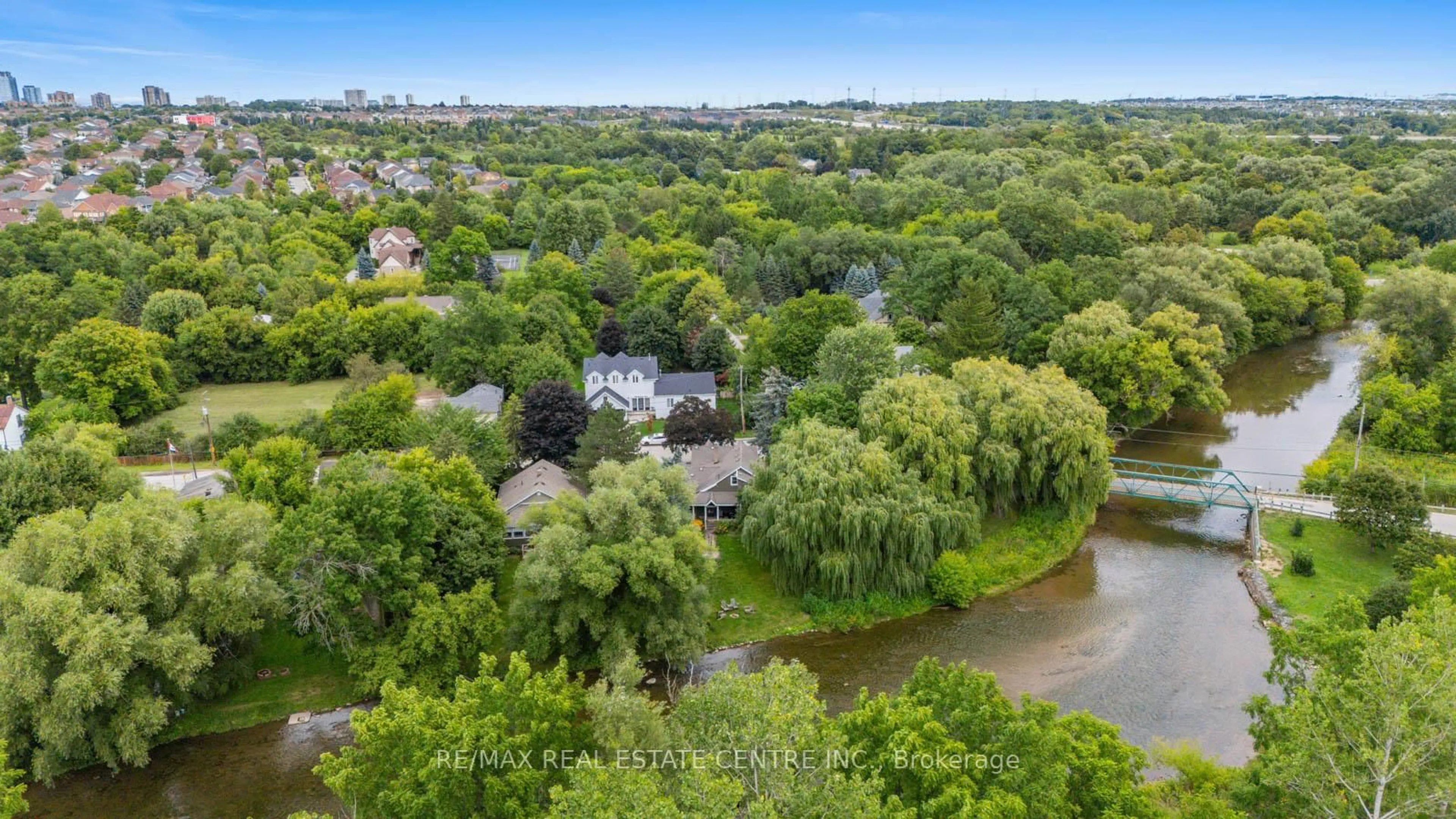 A pic from outside/outdoor area/front of a property/back of a property/a pic from drone, water/lake/river/ocean view for 7736 Churchville Rd, Brampton Ontario L6Y 0H5