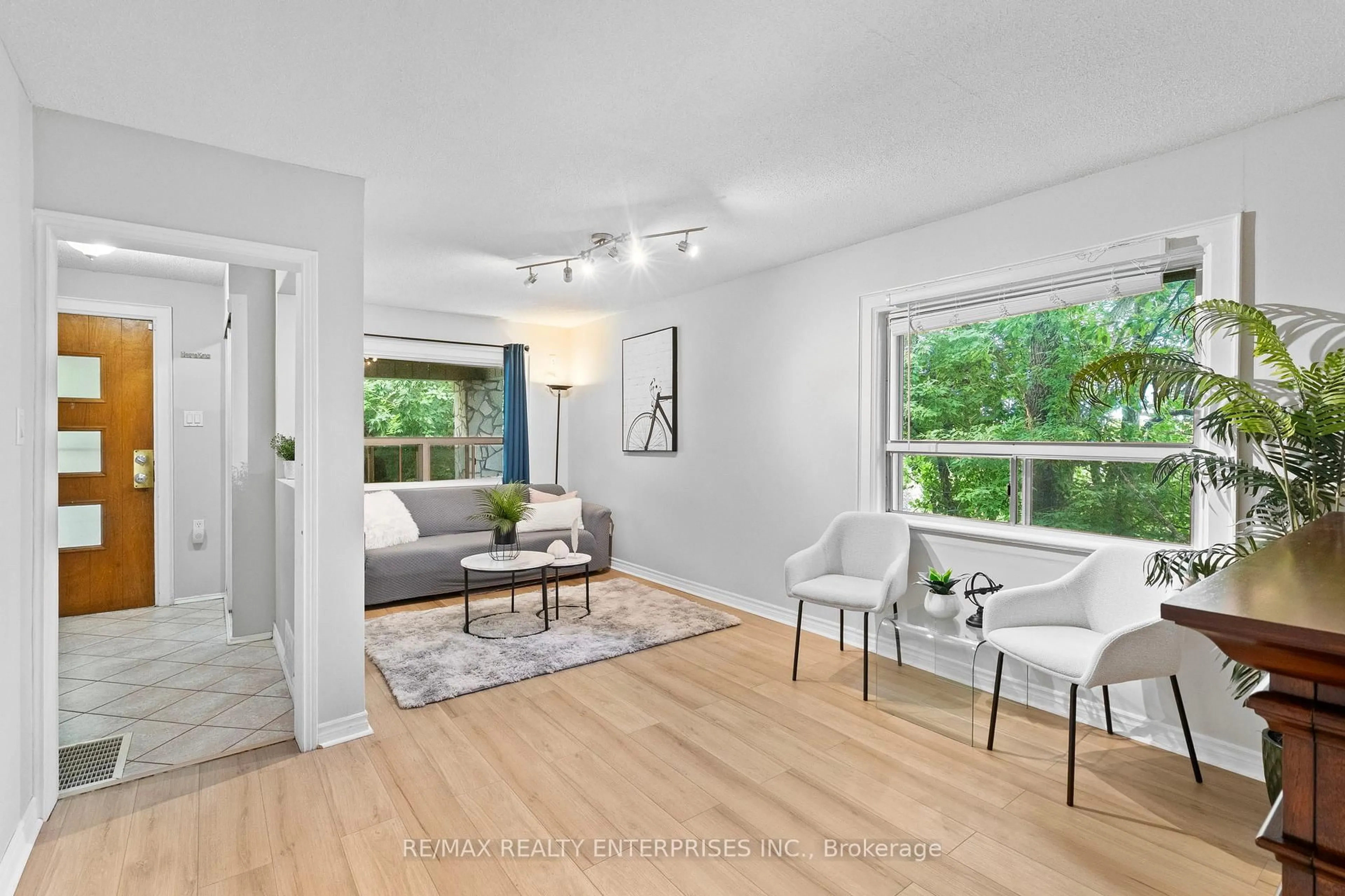 Living room with furniture, wood/laminate floor for 11 Humber Hill Ave, Toronto Ontario M6S 4R9
