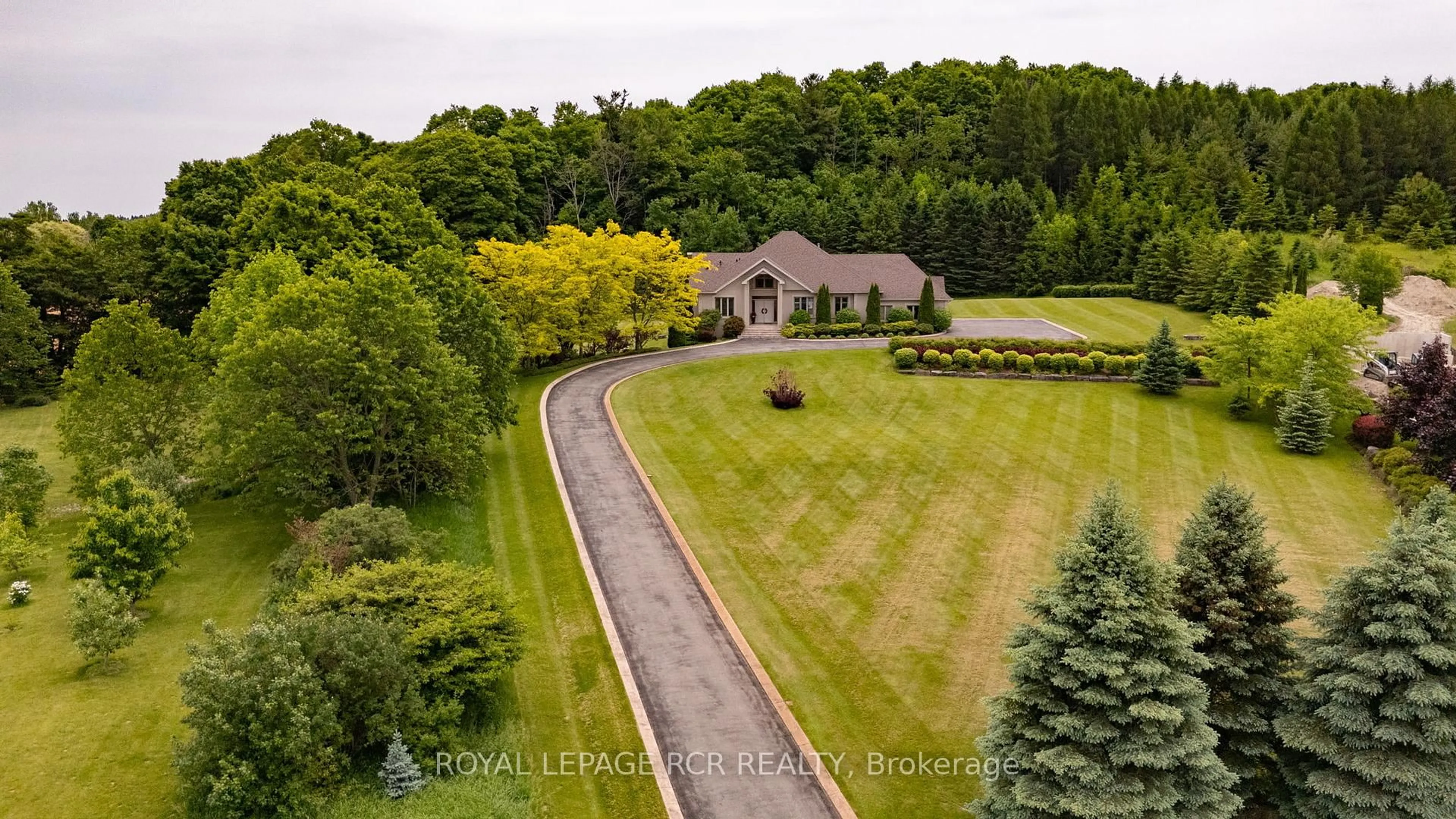 A pic from outside/outdoor area/front of a property/back of a property/a pic from drone, unknown for 5 Woodlot Crt, Caledon Ontario L7E 0C2