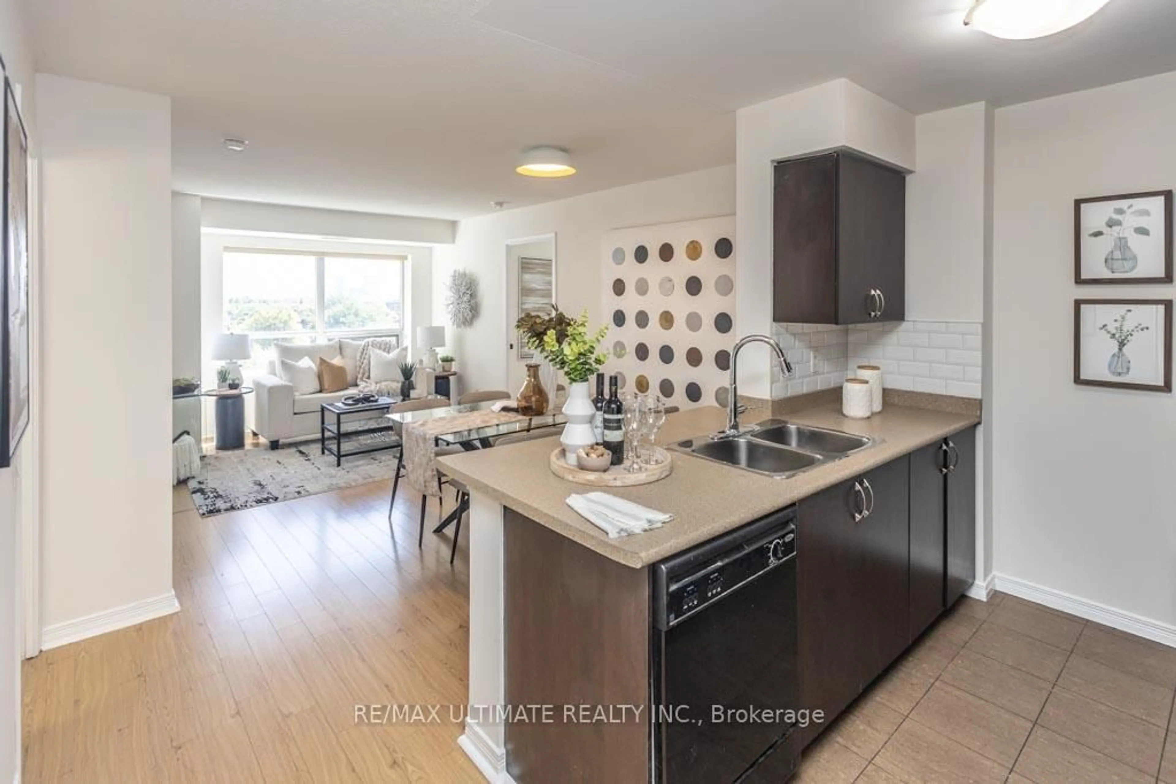 Open concept kitchen, wood/laminate floor for 60 Heintzman St #740, Toronto Ontario M6P 5A1