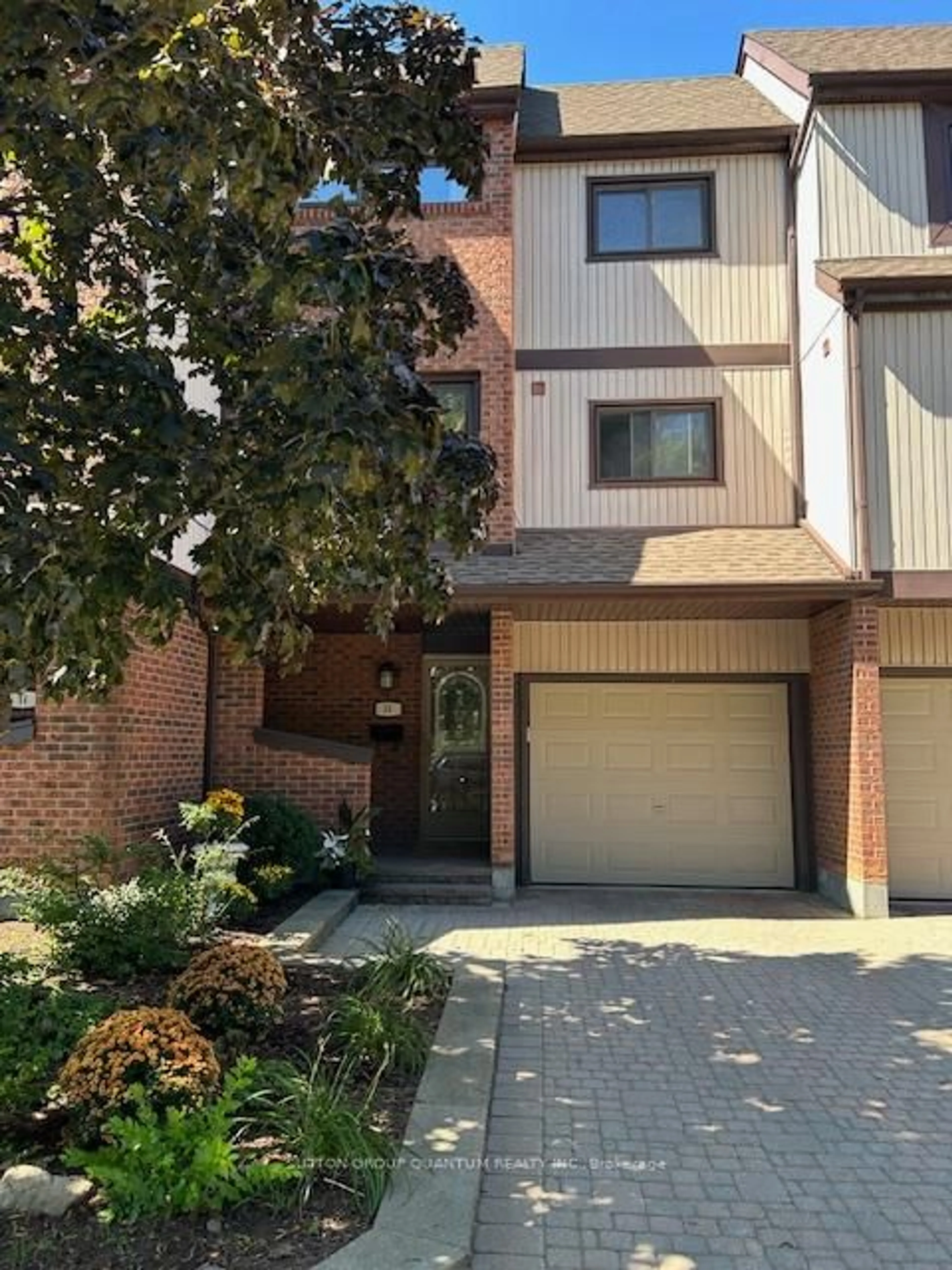 Home with brick exterior material, street for 1020 Walden Circ #15, Mississauga Ontario L5J 4J9