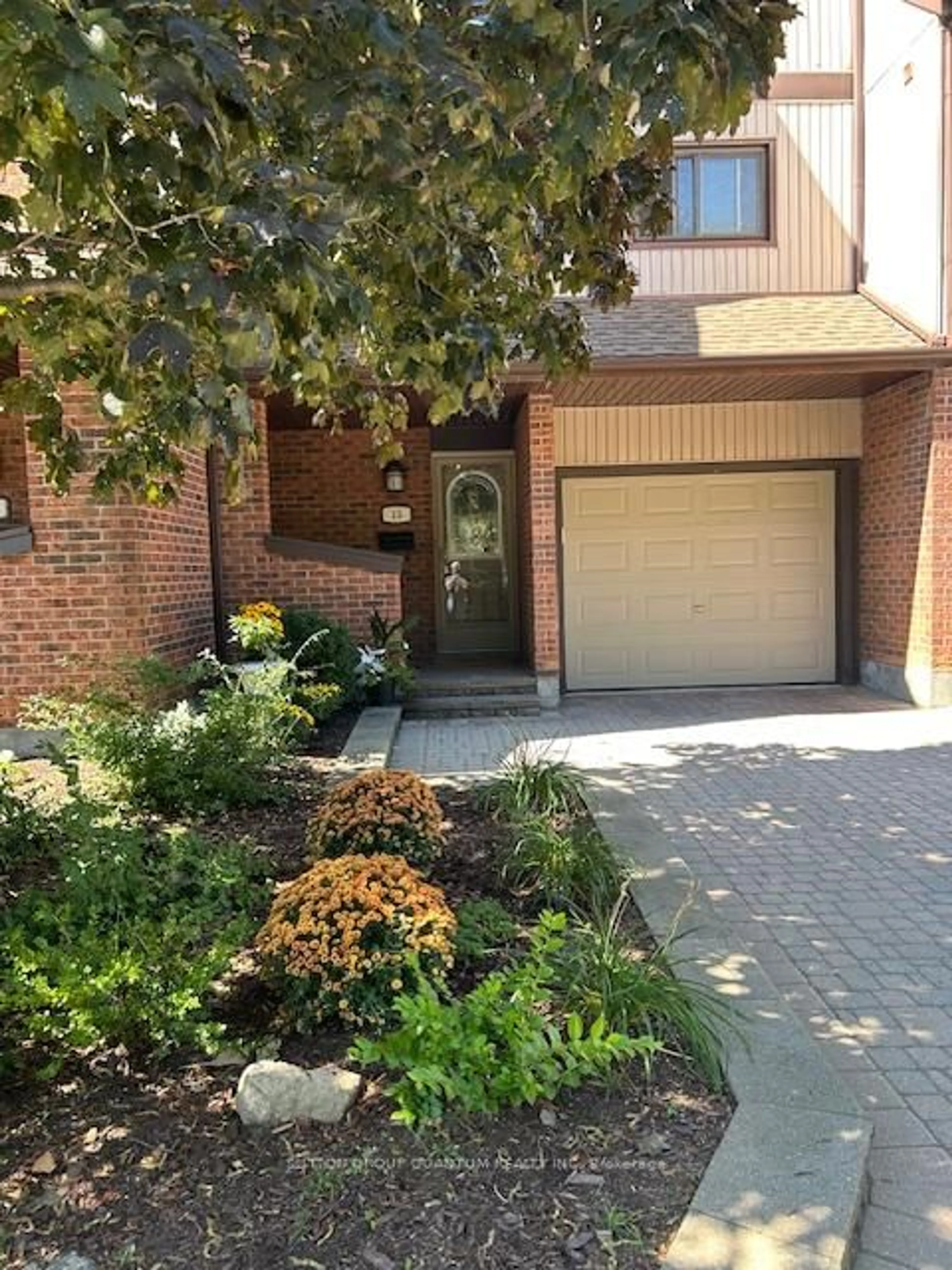 Home with brick exterior material, street for 1020 Walden Circ #15, Mississauga Ontario L5J 4J9