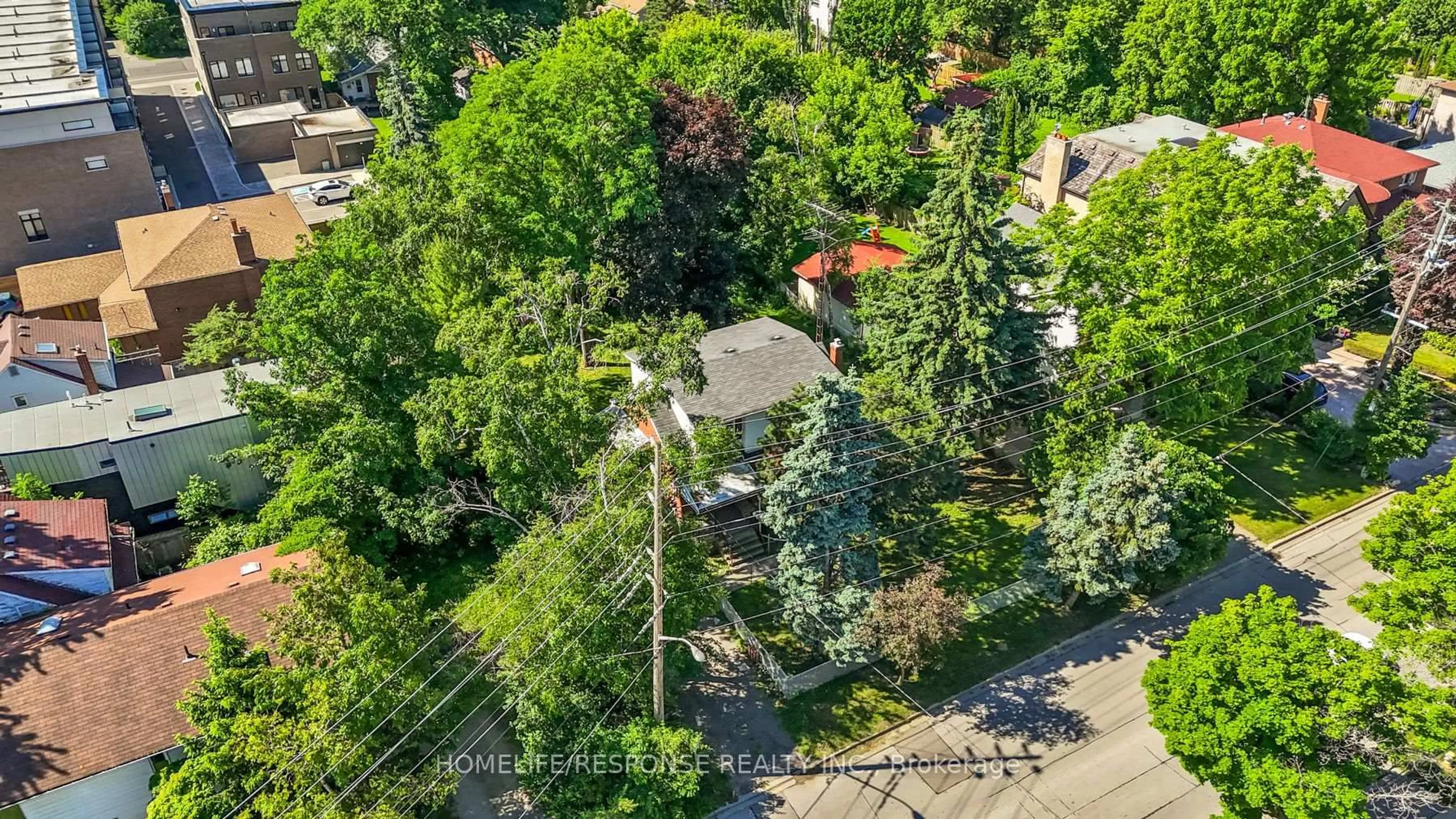 A pic from outside/outdoor area/front of a property/back of a property/a pic from drone, street for 211 Bering Ave, Toronto Ontario M8Z 3A4