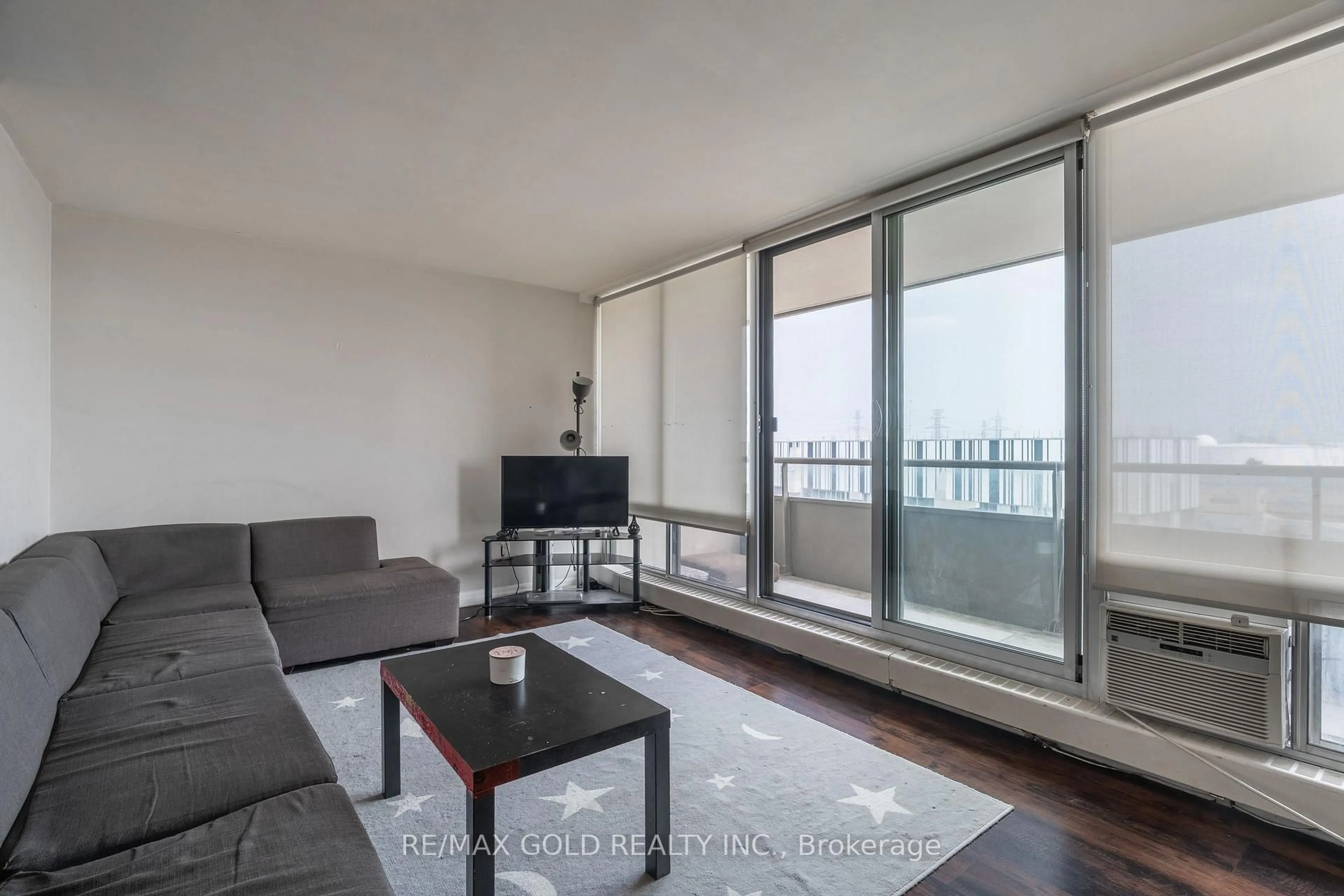 Living room with furniture, wood/laminate floor for 1 Four Winds Dr #502, Toronto Ontario M3J 2T1
